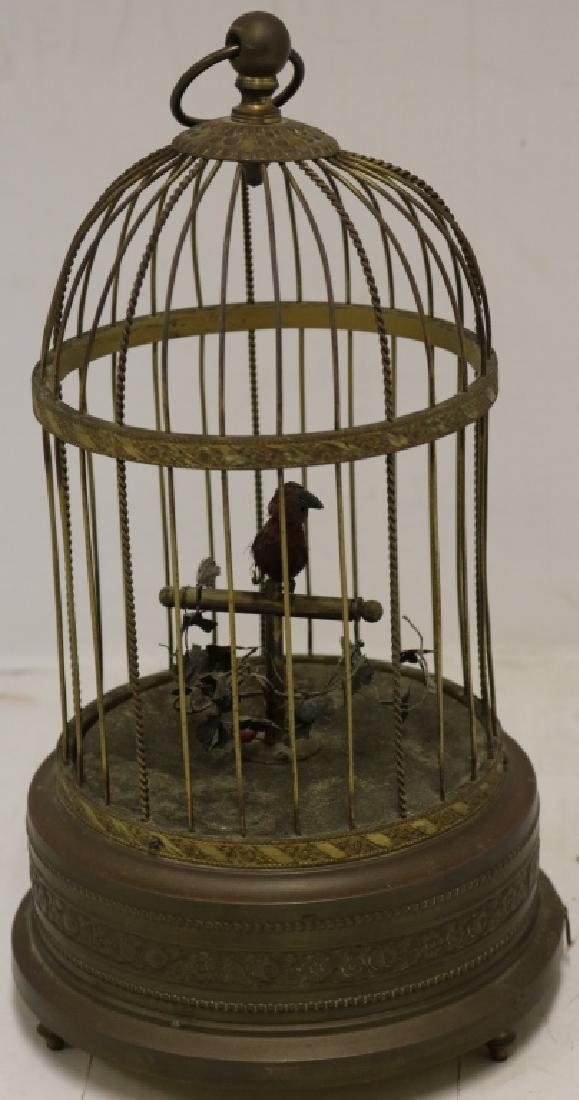 EARLY 20TH C SINGING BIRD IN BRASS CAGE AUTOMATON: MANUFACTURED BY K & G, GERMANY. 12" HIGH, 6 1/2" DEEP. OLD FINISH, WORKING CONDITION.CLICK HERE FOR VIDEO OF WORKING AUTOMATON
