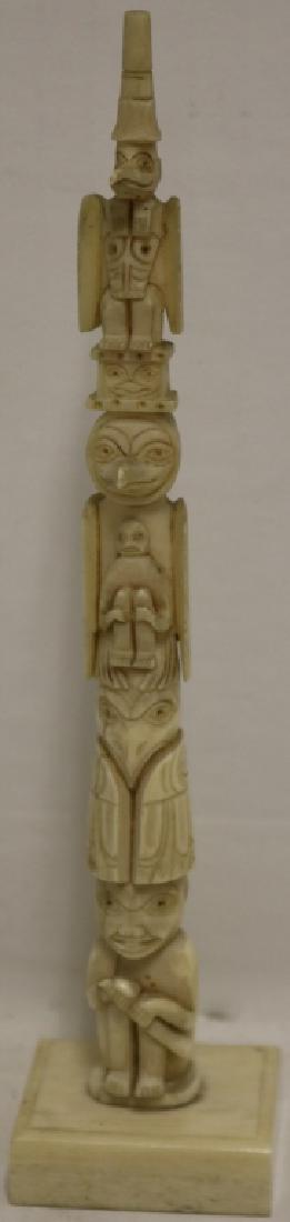 LATE 19TH C CARVED NORTHWEST COAST WALRUS IVORY: TOTEM POLE ON A SQUARE BASE. 7 1/8" TALL. HAS AN OLD CRACK ON BACK.