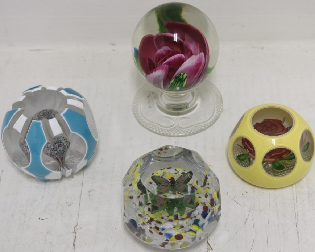 4 PAIRPOINT PAPERWEIGHTS, 2 OVERLAY, 1 WITH ROSE,: 1 WITH MILLEFIORI MUSHROOM. FOOTED ONE WITH ENGRAVED BASE AND ROSE AND ONE IS FACETED WITH A BUTTERFLY. 2" TO 4" HIGH. 3" TO 3 1/4" DIAMETER. PROVENANCE: FROM THE BRYDEN ESTATE.