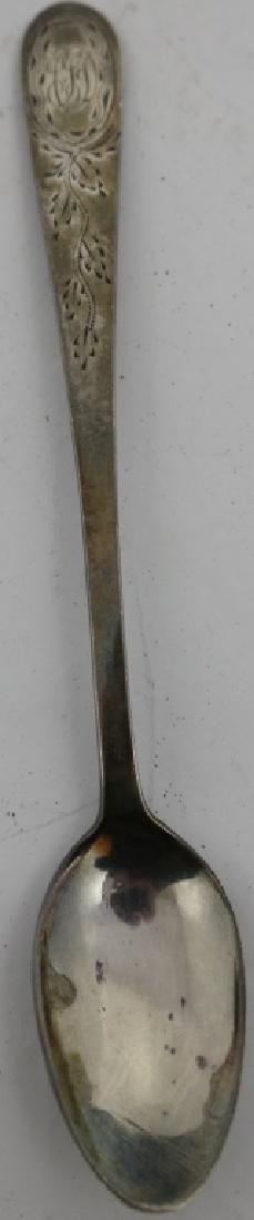 PAUL REVERE, JR. SILVER TEASPOON. THE SPOON HAS: SPATULATE END WITH ENGRAVED FLORAL DESIGN AND MONOGRAM, ELLIPTICAL BOWL, MARKED REVERE IN A RECTANGLE ON VERSO, 6" LONG. THIS COMES WITH A BILL OF SALE FROM JOHN CARBONE, CHARLES STREET, DATED 1941. T