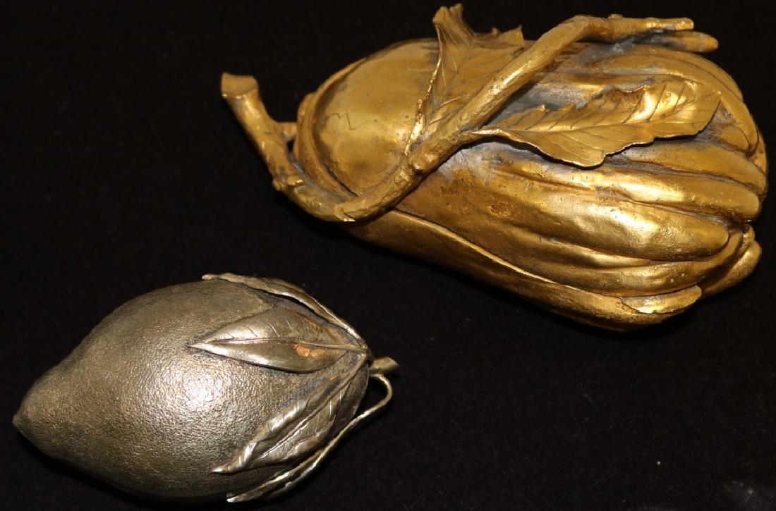 2 COVERED FRUIT FORM BOXES TO INCLUDE AN 8 1/2": HIGH GILT BRONZE BOX AND A 4 3/4" LONG TIFFANY SILVER BOX, 4.5 OZT. PROVENANCE: BOKARA LEGENDRE ESTATE, PARK AVE, NYC.