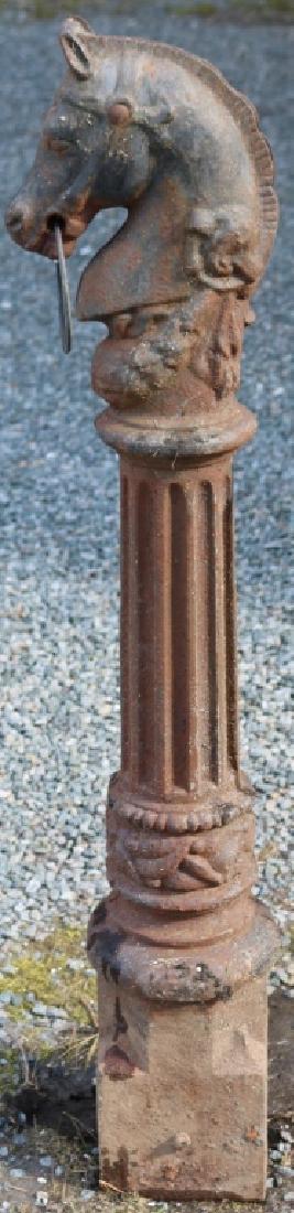 19TH C CAST IRON FIGURAL HITCHING POST, HORSEHEAD: FORM, 44" HIGH, 34 1/2" ABOVE GROUND, 6" WIDE, 9" DEEP. ORIGINAL FINISH, SOME RUST, REPLACED RING.
