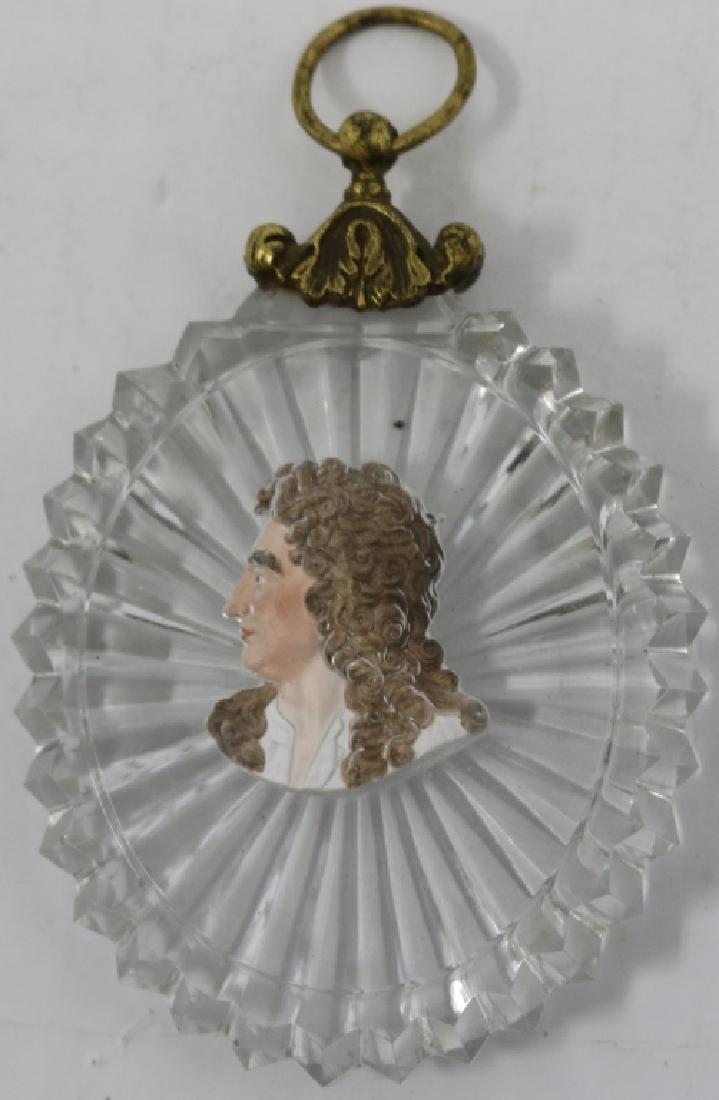 EARLY 19TH C SULFIDE PAPERWEIGHT, OVAL SHAPED: MEDALLION WITH BUST, AN 18TH C NOBLEMAN, STAR CUTTING ON THE BACK AND SAWTOOTH EDGE. BRASS MOUNT. 4" X 2 3/4". GOOD CONDITION.