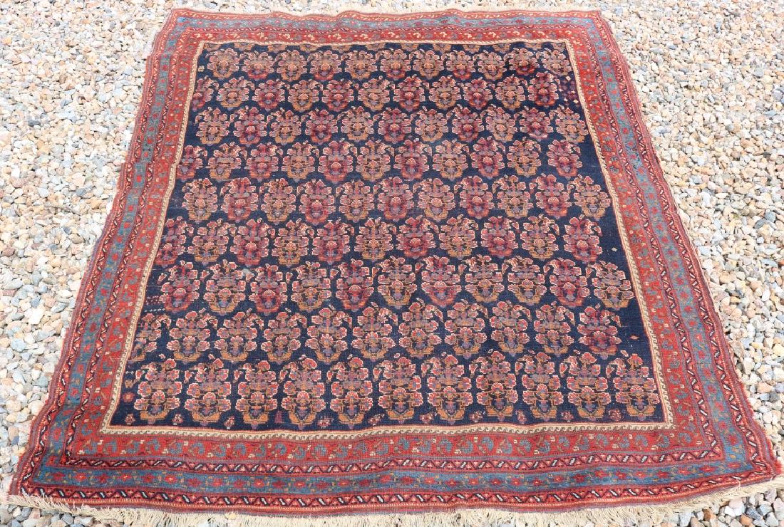 SEMI-ANTIQUE PERSIAN AREA RUG, UNUSUAL FLORAL: PALMETTE DESIGN IN CENTER, GEOMETRIC BORDER. 4' 4" X 4' 11".