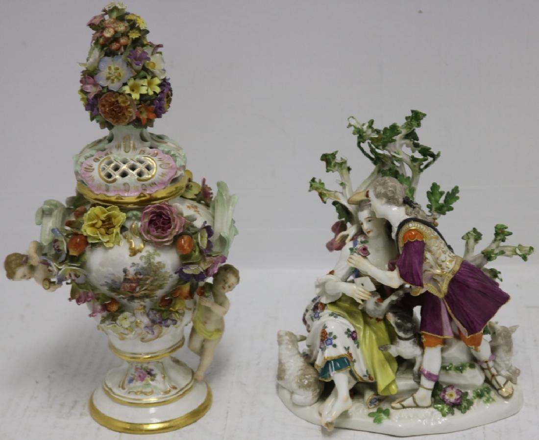 2 PIECE OF LATE 19TH C MEISSEN TO INCLUDE FIGURAL: GROUP WITH YOUNG LOVERS WITH DAMAGE TO LEAVES AND FEET, 8" HIGH. ALONG WITH AN URN WITH CHERUBS AND FLORAL DECORATION WHICH HAS SEVERAL DAMAGED FLOWER PETALS, 12" HIGH.