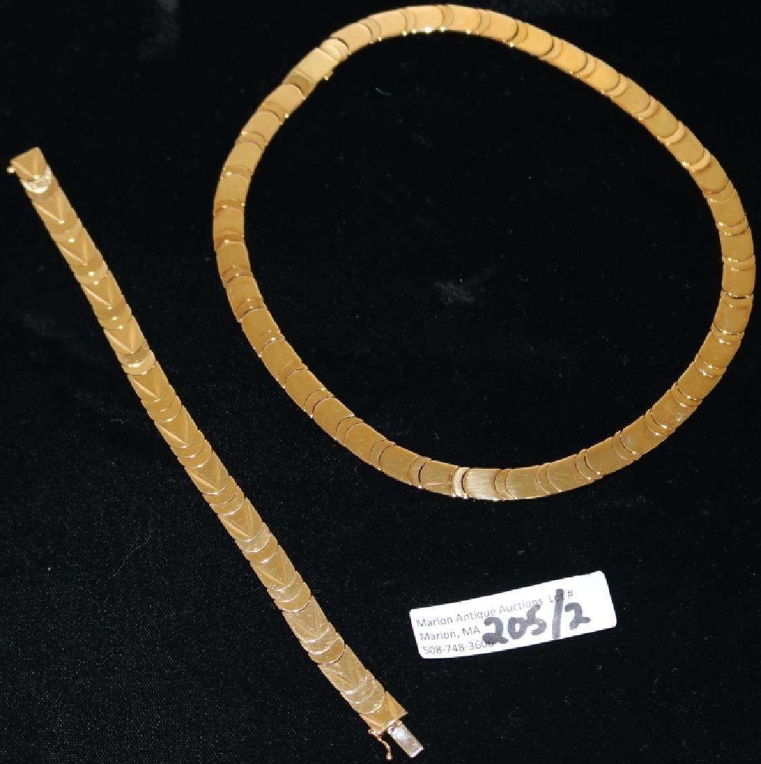 14KT. GOLD NECKLACE AND MATCHING BRACELET SOLD BY: BAILEY, BANKS AND BIDDLE. IN CUSTOM CASE. NECKLACE APPROXIMATELY 15" LONG, BRACELET 7" LONG. TOTAL WEIGHT 46.1 DWT. **QUALIFIED BIDDERS ONLY**-GOLD, COINS AND JEWELRY- SHIPPING IS SUBJECT TO A 2 (TWO)