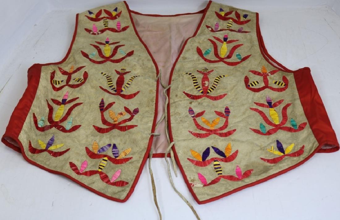 EARLY 20TH C PLAINS INDIAN DYED QUILL VEST,: GEOMETRIC DESIGN, 23 1/2" LONG. SOME LOSS TO QUILLS AND STAINING TO FABRIC.
