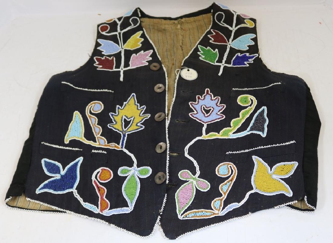 LATE 19TH C WINNEBAGO BEADED VEST WITH: GEOMETRIC FLORAL DESIGN BLACK CLOTH WITH A LINED INTERIOR, ABALONE BUTTONS, 21" LONG X 18" WIDE. LINING SHOWS WEAR AND SEPARATION.