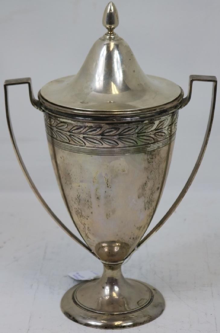TIFFANY & CO. STERLING SILVER CLASSICAL COVERED: URN WITH HANDLES, ACORN SHAPED FINIAL, APPROXIMATELY 12" HIGH WITH ENGRAVED FOLIATE DESIGN, 23.035 TROY OUNCES.
