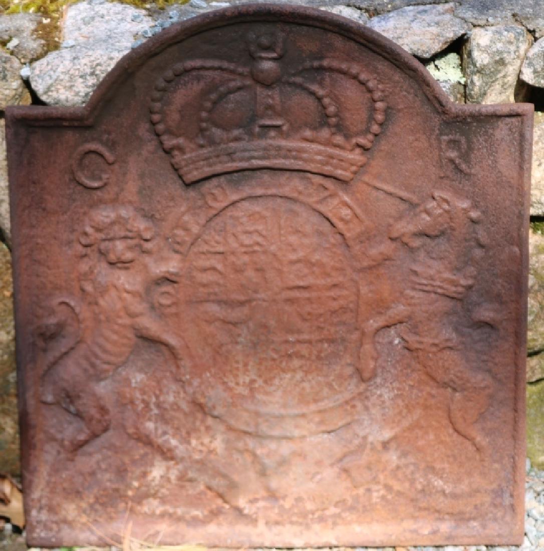 LATE 18TH C GEORGIAN CAST IRON FIREBACK WITH: TOMBSTONE SHAPE GEORGIAN CREST WITH LION AND UNICORN. USED CONDITION. 23 1/4" HIGH, 21 1/2" WIDE.