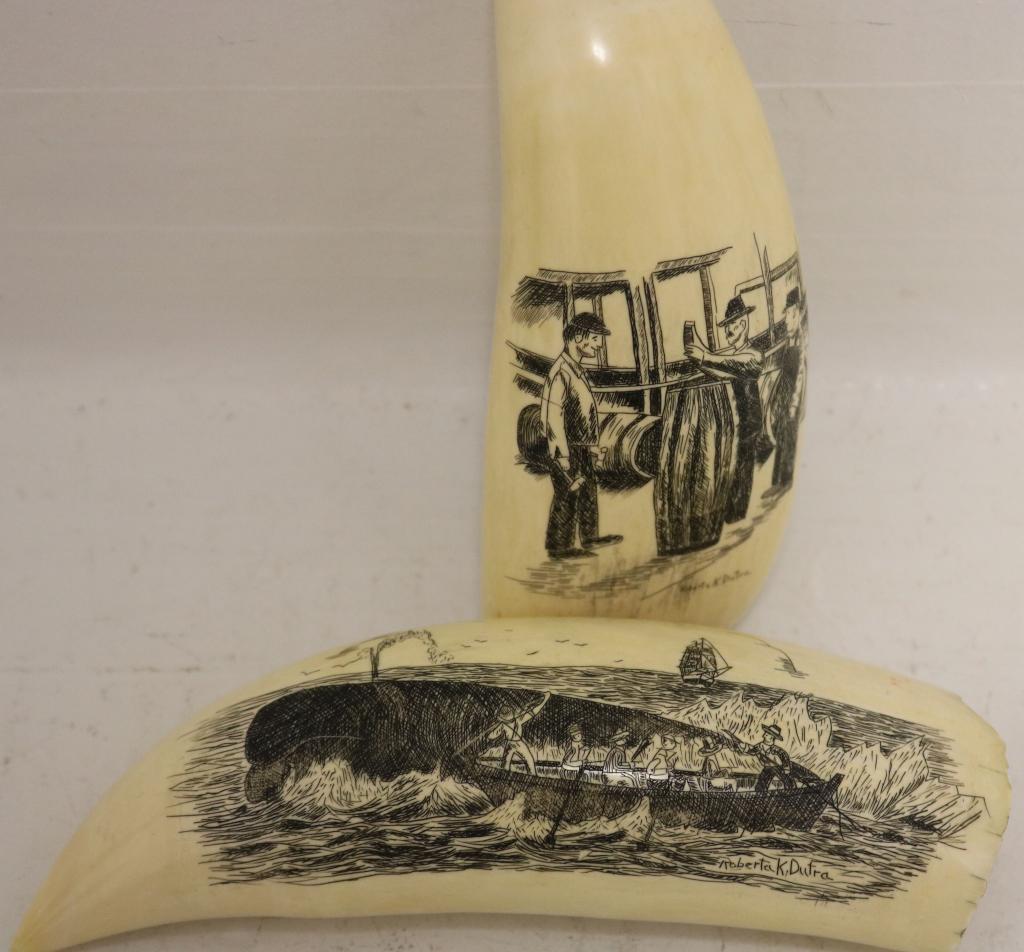 2 LATE 20TH C SCRIMSHAW WHALES TEETH BY NEW: BEDFORD SCRIMSHAW ARTIST ROBERTA DUTRA. ONE DEPICTS 3 MEN MEASURING WHALE OIL IN BARRELS, 5 3/4", GOOD CONDITION. THE OTHER DEPICTS 6 MEN IN A WHALE BOAT HARPOONING A WHALE, 6 1/2", SIGNED LOWER RIGHT