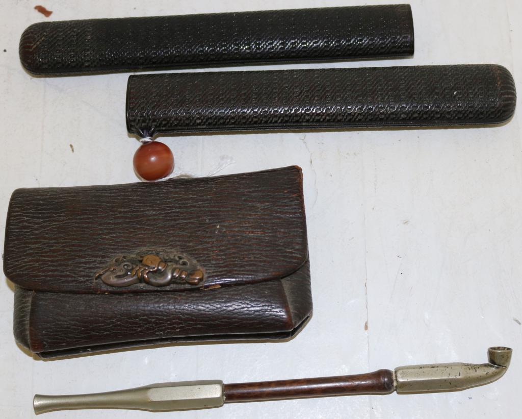 19TH C JAPANESE OPIUM PIPE WITH CASE AND POUCH,: A MIXED METAL MEDALLION, 5" WIDE POUCH, PIPE 7 3/4" LONG.