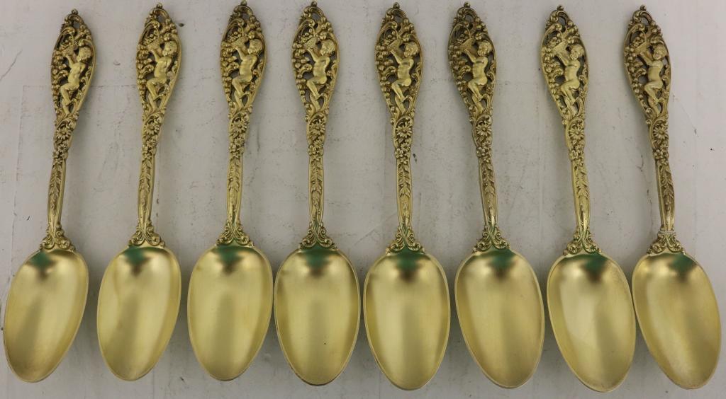 SET OF STERLING SILVER 7" GOLD WASHED SPOONS: BY DOMINICK & HAFF, LATE 19TH C, ORNATE PIERCE WORK HANDLE WITH CHERUB AND BASKET OF FRUIT. PROVENANCE: FAY MICHENER ESTATE, NYC.