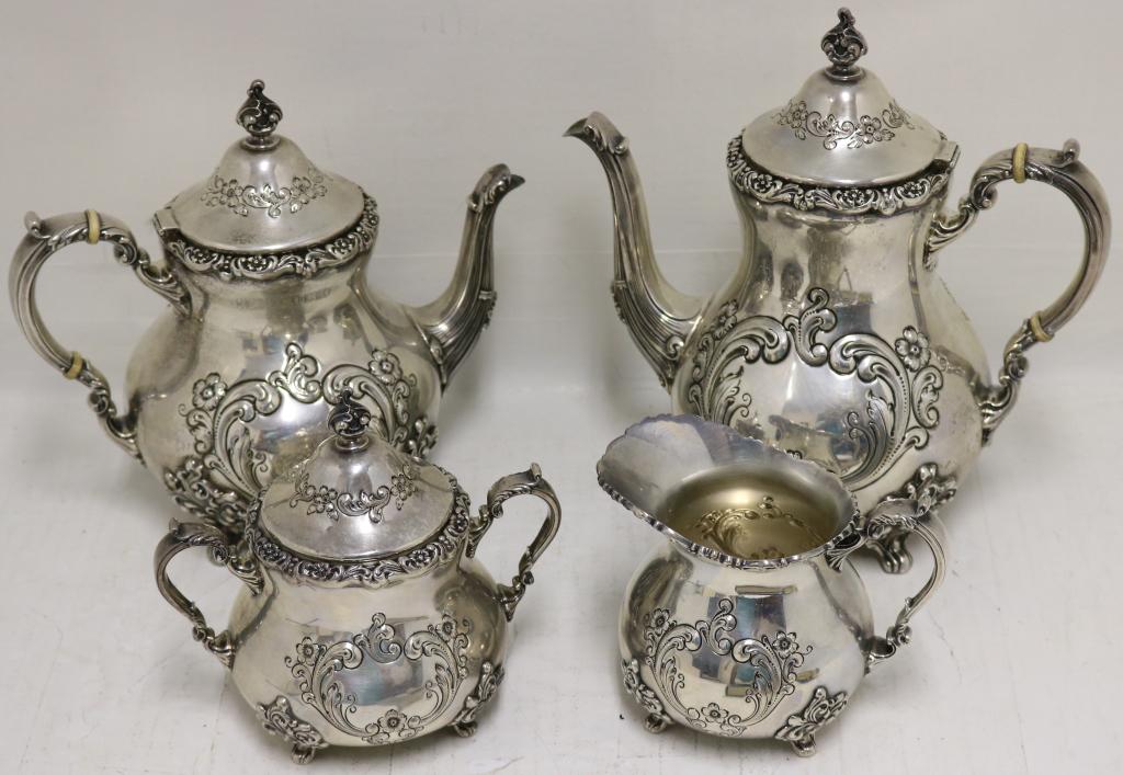 4 PIECE STERLING SILVER TEA SET BY POOLE, HAND: CHASED IN THE "OLD ENGLISH" PATTERN. NO MONOGRAM. 4 1/2" CREAMER, 6" COVERED SUGAR BOWL, 8 1/2" TEA POT, 10" COFFEE POT. 91 OZT. EXCELLENT CONDITION.