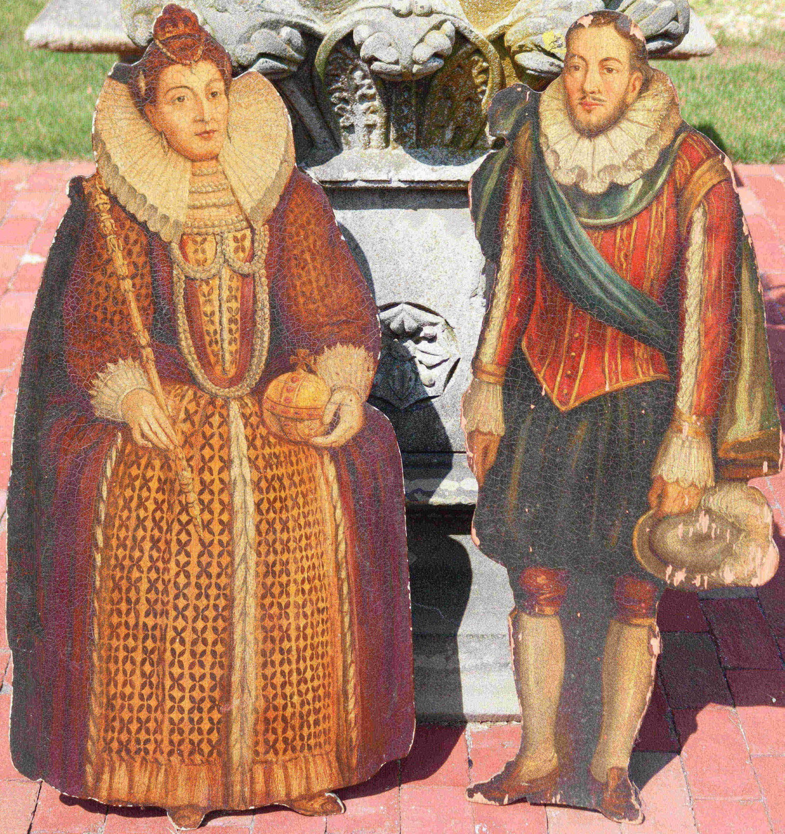 PAIR OF ENGLISH FIGURAL DUMMY BOARDS FROM THE: EARLY 19TH CENTURY. PAINTED AND CARVED WOODEN FIGURES DEPICTING KING FERDINAND AND QUEEN ISABELLA OF SPAIN. LACQUER OVER WOOD WITH WONDERFUL ORIGINAL PAINT. FERDINAND IS 37 3/4" HIGH AND 14 1/4" WIDE.