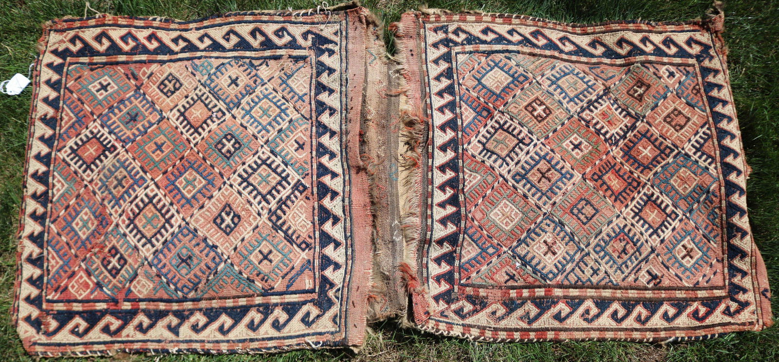 LATE 19TH CENTURY SOUMAK DOUBLE SADDLE BAG. SHOWS: WEAR AND LOSS TO EDGES. 24" X 50".