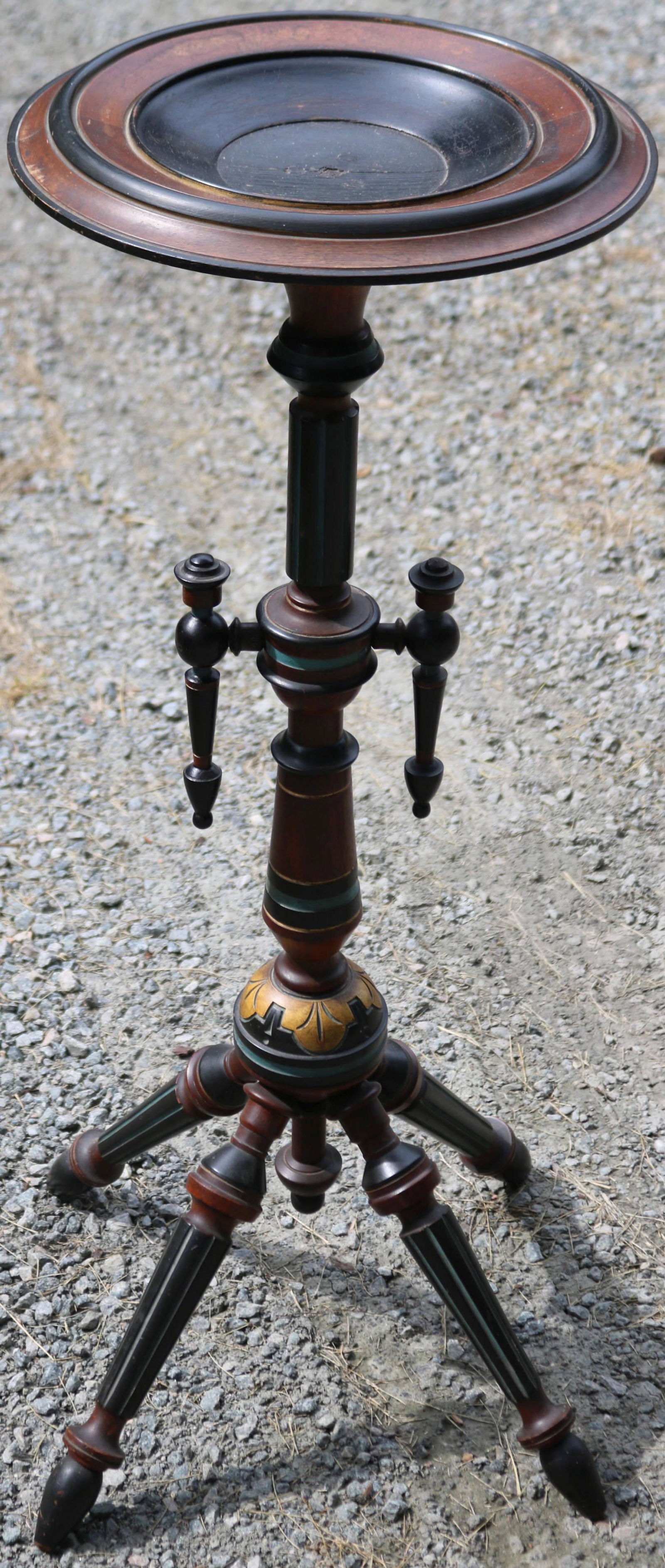 LATE 19TH CENTURY AESTHETIC MOVEMENT PLANT STAND.: EBONY WITH POLYCHROME DECORATION. FOUR SPLAY LEGS. 32 1/2" HEIGHT, TOP 12 1/2" DIAMETER, 12 3/4" X 12 3/4" BASE.