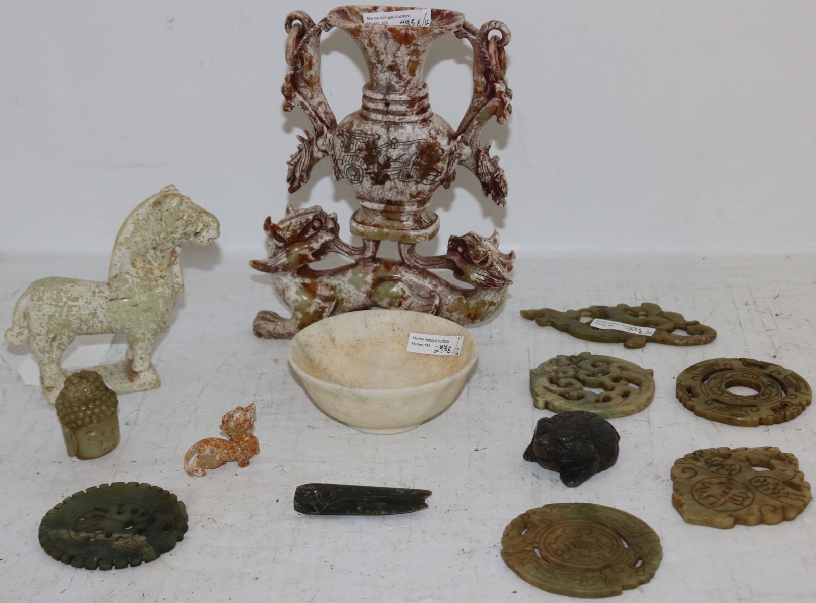 LOT OF TWELVE JADE AND CARVED HARDSTONE ITEMS,: 20TH CENTURY CHINESE. RANGING IN SIZE FROM 1 1/2" TO 9". TO INCLUDE: A BOWL, HORSE, DRAGON, BUDDHA HEAD, VASE WITH DRAGONS, DISCS AND AMULETS, ETC.
