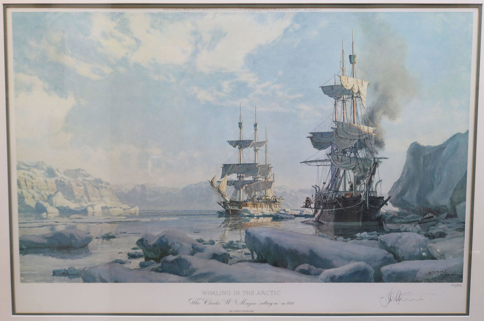 JOHN STOBART (B. 1929, NANTUCKET & WESTPORT,: MA) FRAMED AND GLAZED SIGNED LIMITED EDITION COLORED PRINT, NO. 317/850. SIGNED LOWER RIGHT. TITLED "WHALING IN THE ARCTIC". SIGHT SIZE 22" X 33", OVERALL WITH FRAME 31 1/2" X 42". COMES WITH A BOOK T