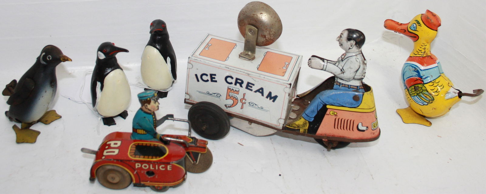 LOT OF 4 TIN LITHOGRAPH WIND-UP TOYS, ALONG WITH (1 of 4)