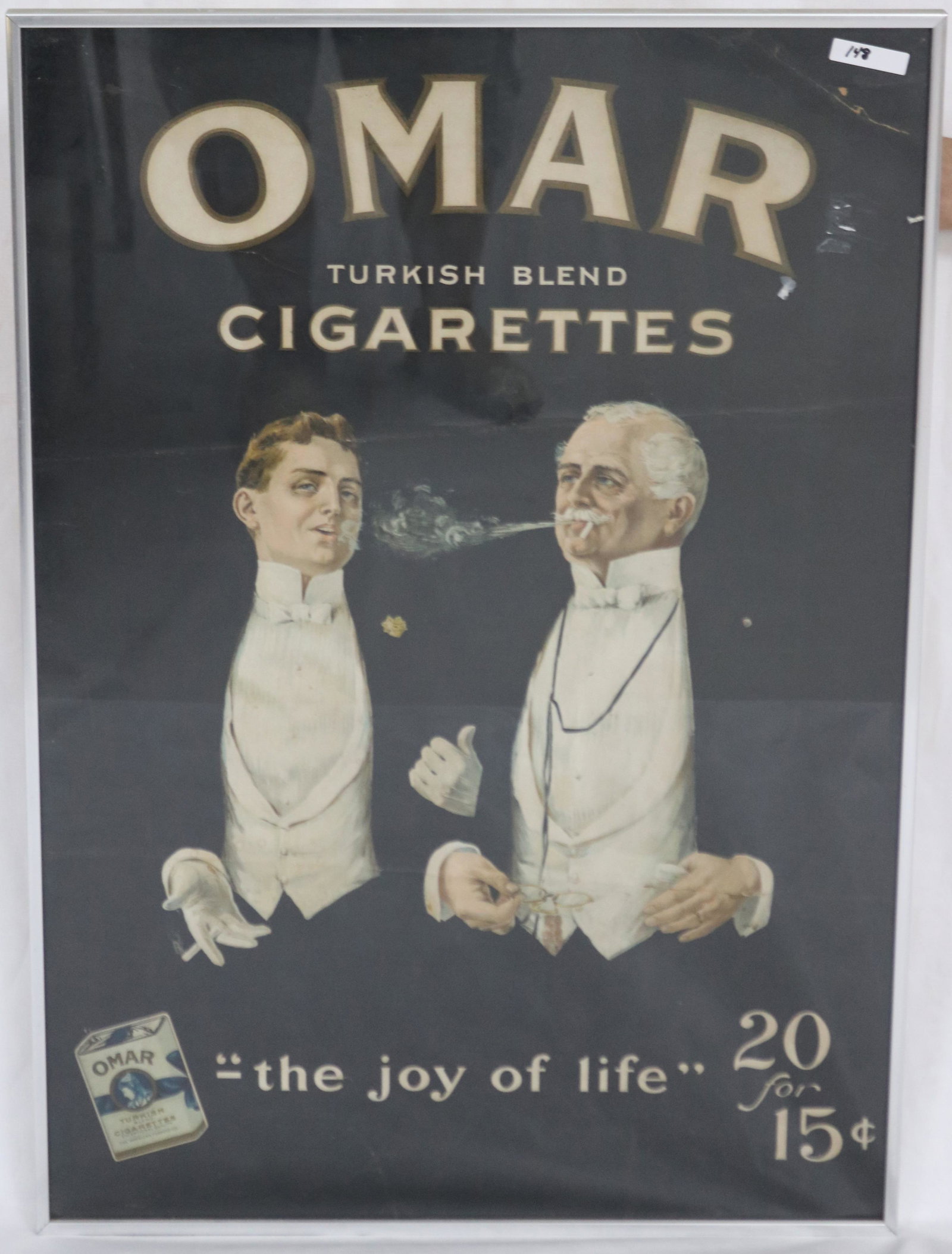 CONTEMPORARY FRAMED CARDBOARD ADVERTISING SIGN,: OMAR CIGARETTES, SHOWS OLD CREASING, SOME REPAIRS, OVERALL 30 1/4" X 21 1/4".