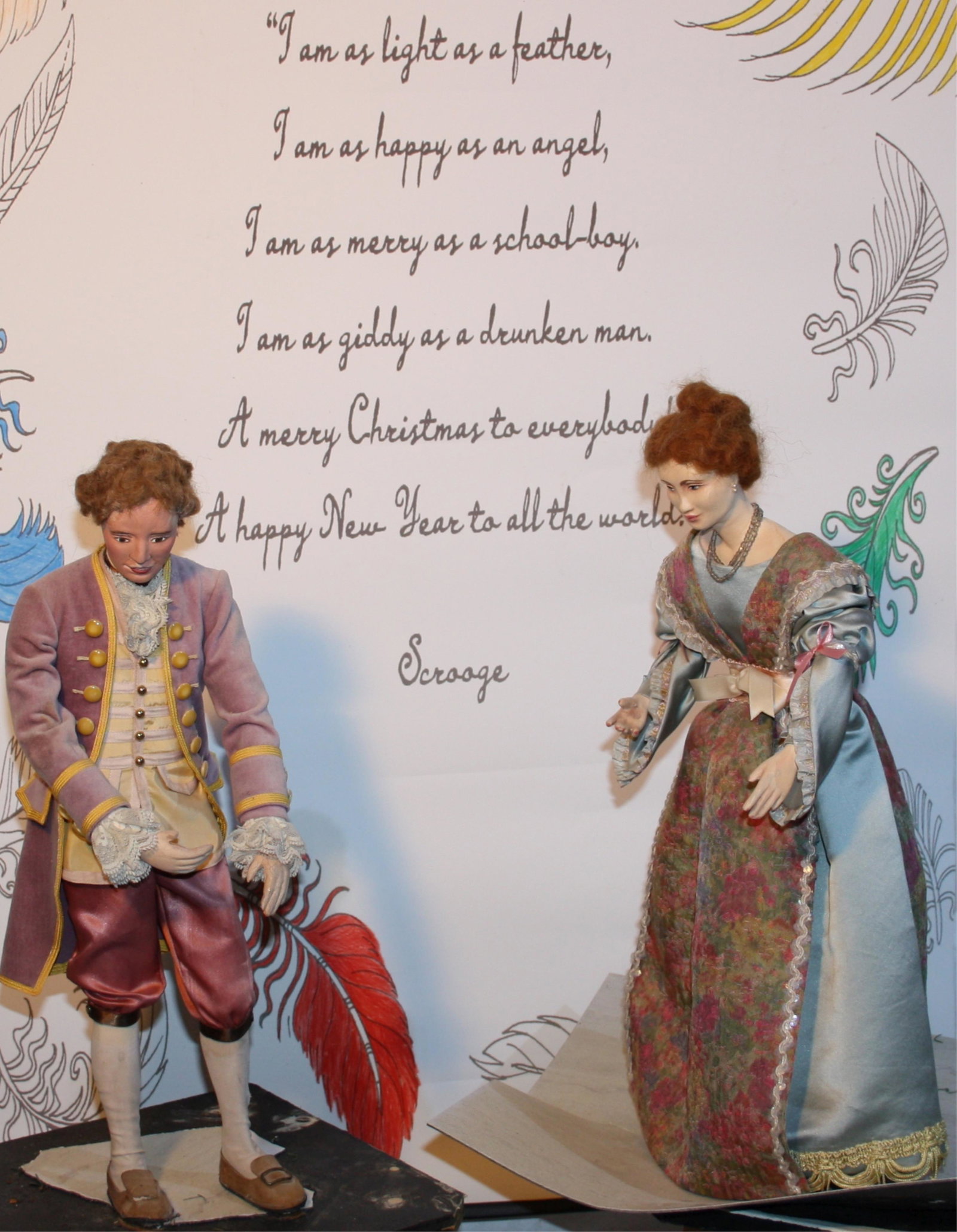 TWO MID-20TH CENTURY DICKENSIAN AUTOMATON: CHARACTERS, VERY ELEGANTLY DRESSED COUPLE. COMPOSITION BODIES. THE MAN IS 20" TALL, AND 32" TALL WITH THE BASE; THE LINOLEUM FROM HIS BASE IS MISSING. THE WOMAN IS 20" TALL, AND 33" TALL WITH THE BASE