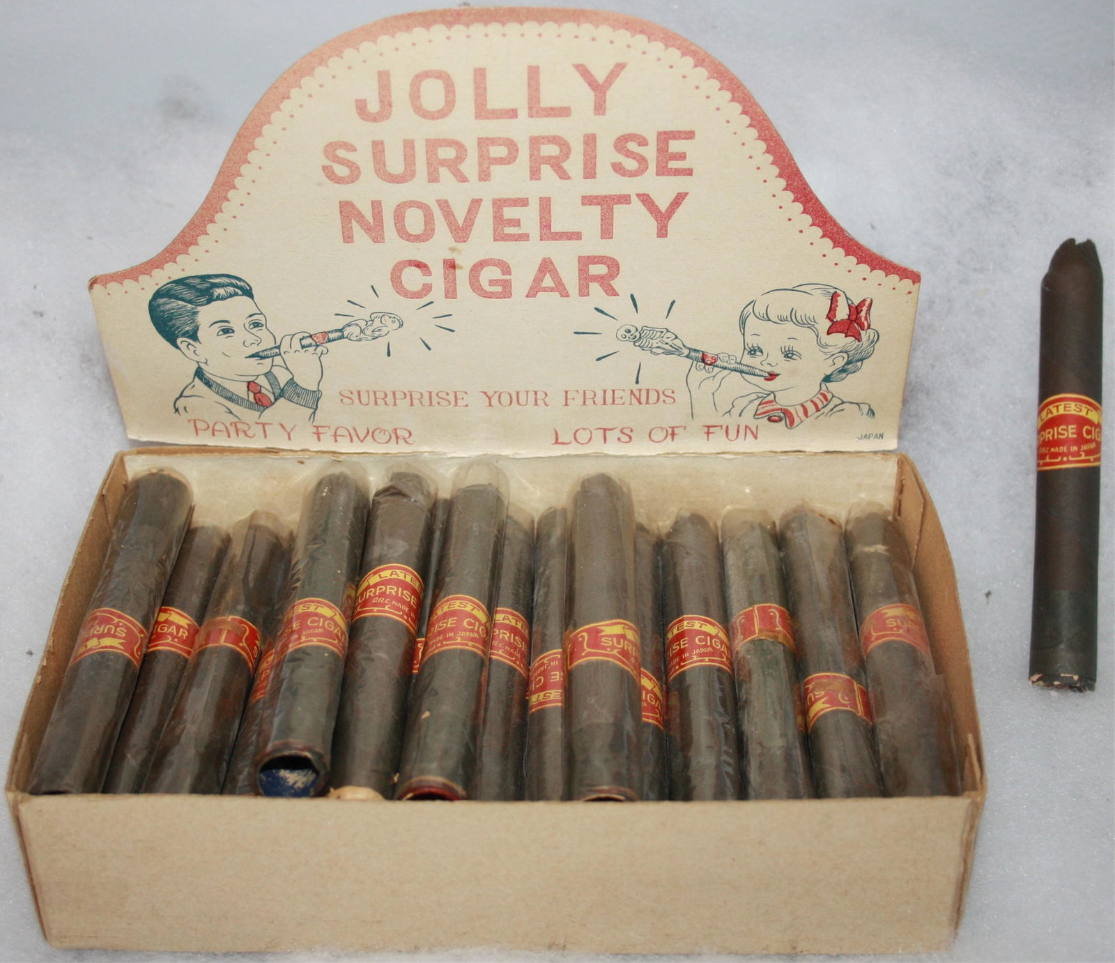 JOLLY SURPRISE NOVELTY CIGAR COUNTRY STORE: DISPLAY CONTAINING 29 UNUSED PARTY FAVOR CIGARS.