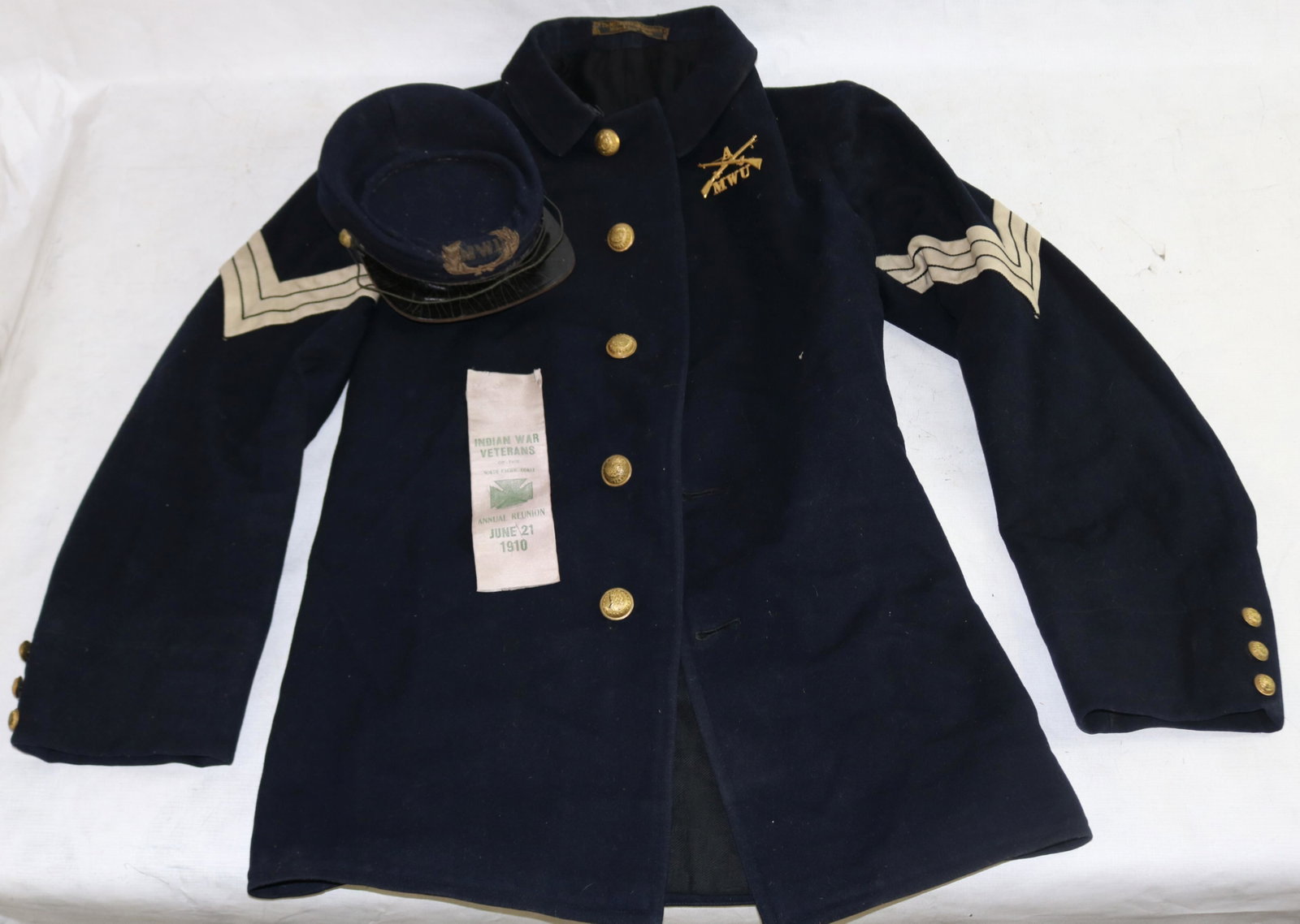 INDIAN WARS ARMY JACKET, CAP, AND, RIBBON.: SERGEANT FORT SHAW, MONTANA TERRITORY. 1867-1890. FORT SHAW IS NAMED AFTER COL ROBERT G. SHAW WHO COMMANDED THE ALL BLACK 54TH REGIMENT DURING THE CIVIL WAR. THE UNIFORM POSSIBLY SAW ACTION DURING THE