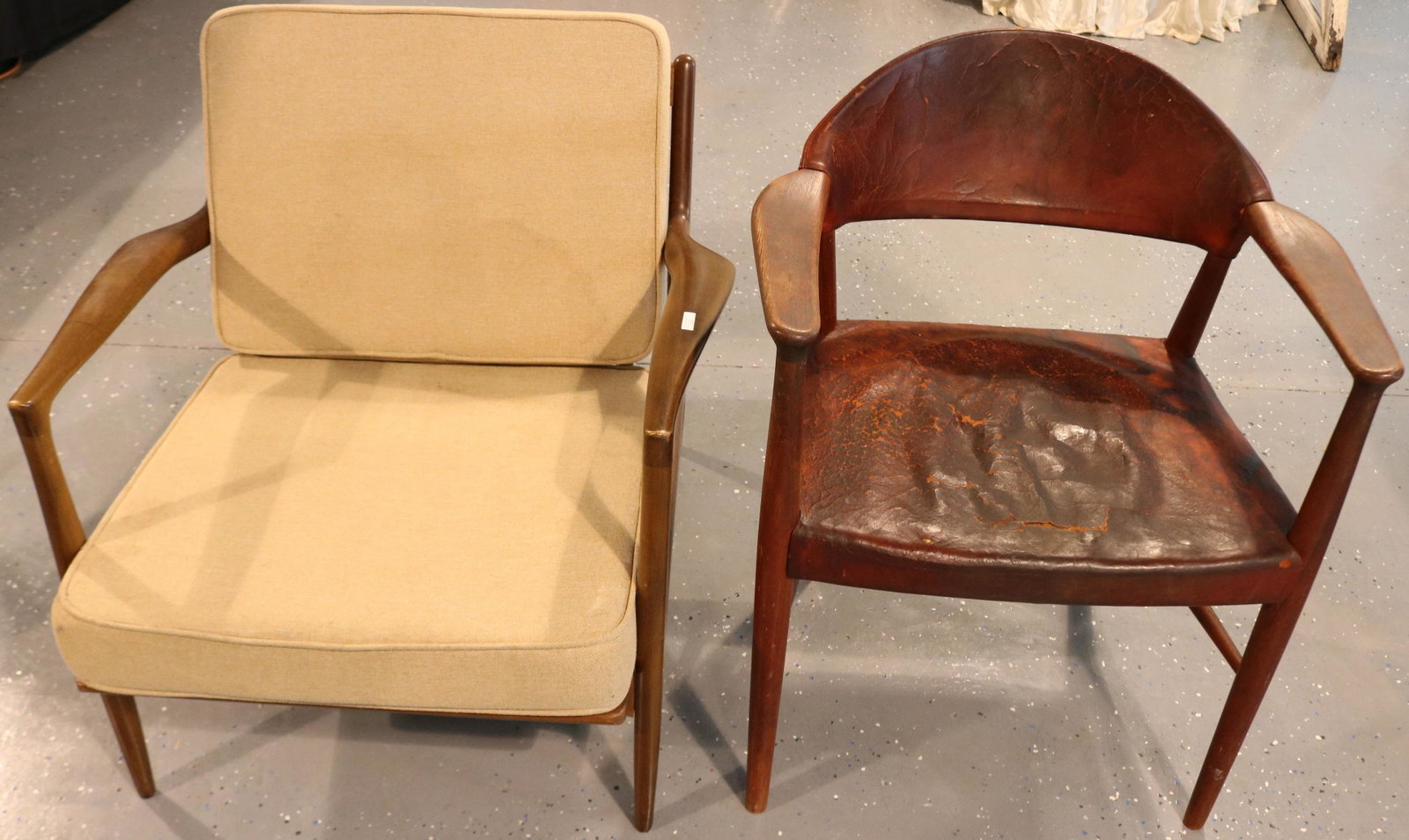 TWO MID-CENTURY MODERN DANISH ARMCHAIRS. ONE BY: SELIG (LOOSE UPHOLSTERED CUSHIONS), AND THE OTHER IS BY CHARLES LARSON AND SON (TEAK WITH LEATHER SEAT AND BACK, LEATHER SEAT SHOWS DAMAGE). BOTH CHAIRS ARE SIGNED. LARSON CHAIR IS 31" HIGH, 25" WIDE,