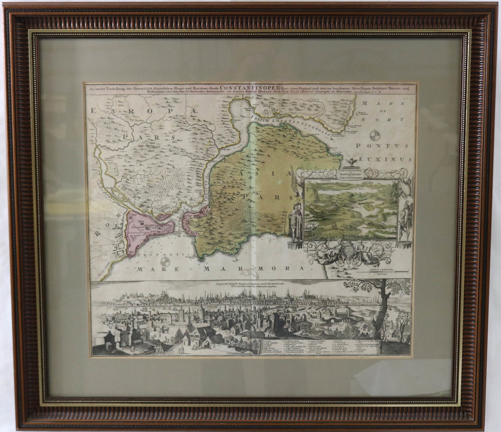 17TH CENTURY COLORED MAP OF CONSTANTINOPLE. BY: JOHANNES BAPTIST HONANN. LATIN TEXT. BOTTOM HALF OF THE MAP IS AN ENGRAVING OF THE CITY. SHOWS FOLDED CREASE IN CENTER. OVERALL GOOD CONDITION. NICELY FRAMED WITH MODERN MATTING AND FRAME. SIGHT SIZE 