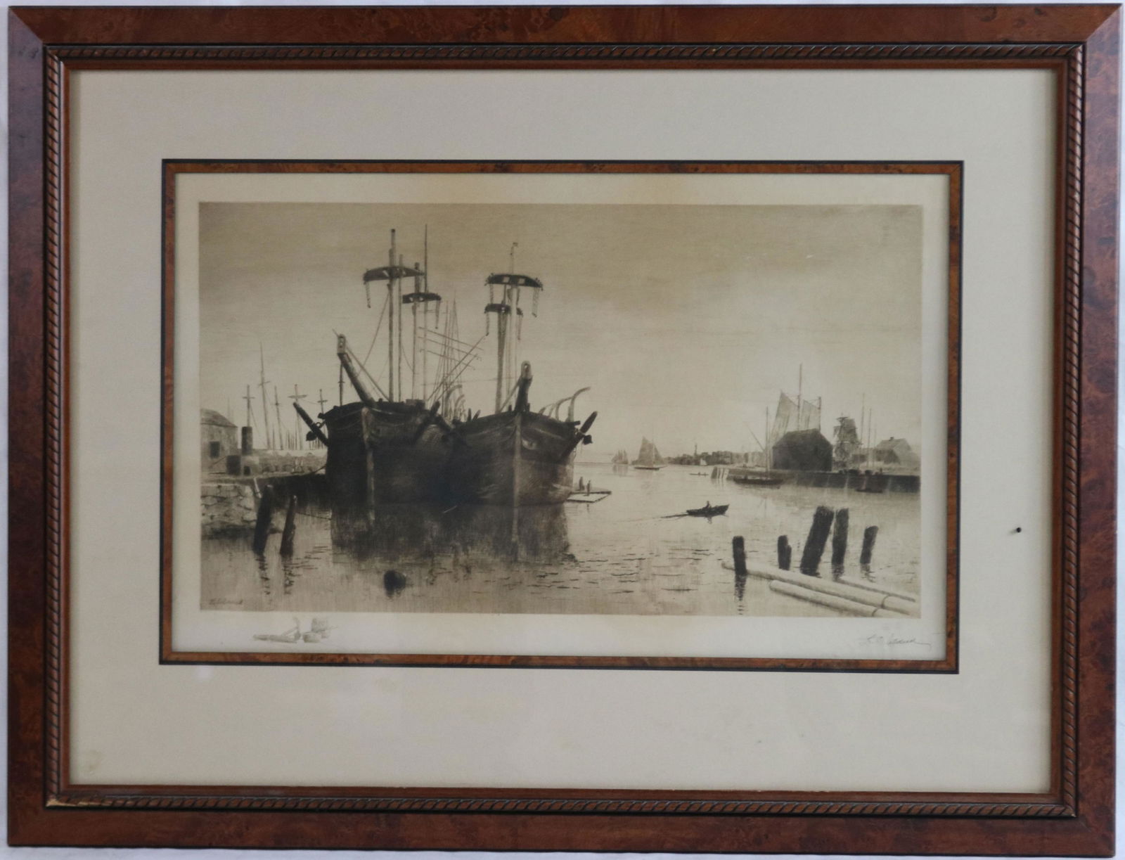 LEMUEL D. ELDRED (1848-1921, FAIRHAVEN) FRAMED: ETCHING OF WHALERS AT THE DOCK IN NEW BEDFORD. SIGNED LOWER RIGHT IN PENCIL, AND LOWER LEFT IN THE PLATE. SIGHT SIZE 14 1/2" X 23 1/4", OVERALL WITH FRAME 25 3/4" X 35 1/2" . IN HIGH QUALITY BURL WALN