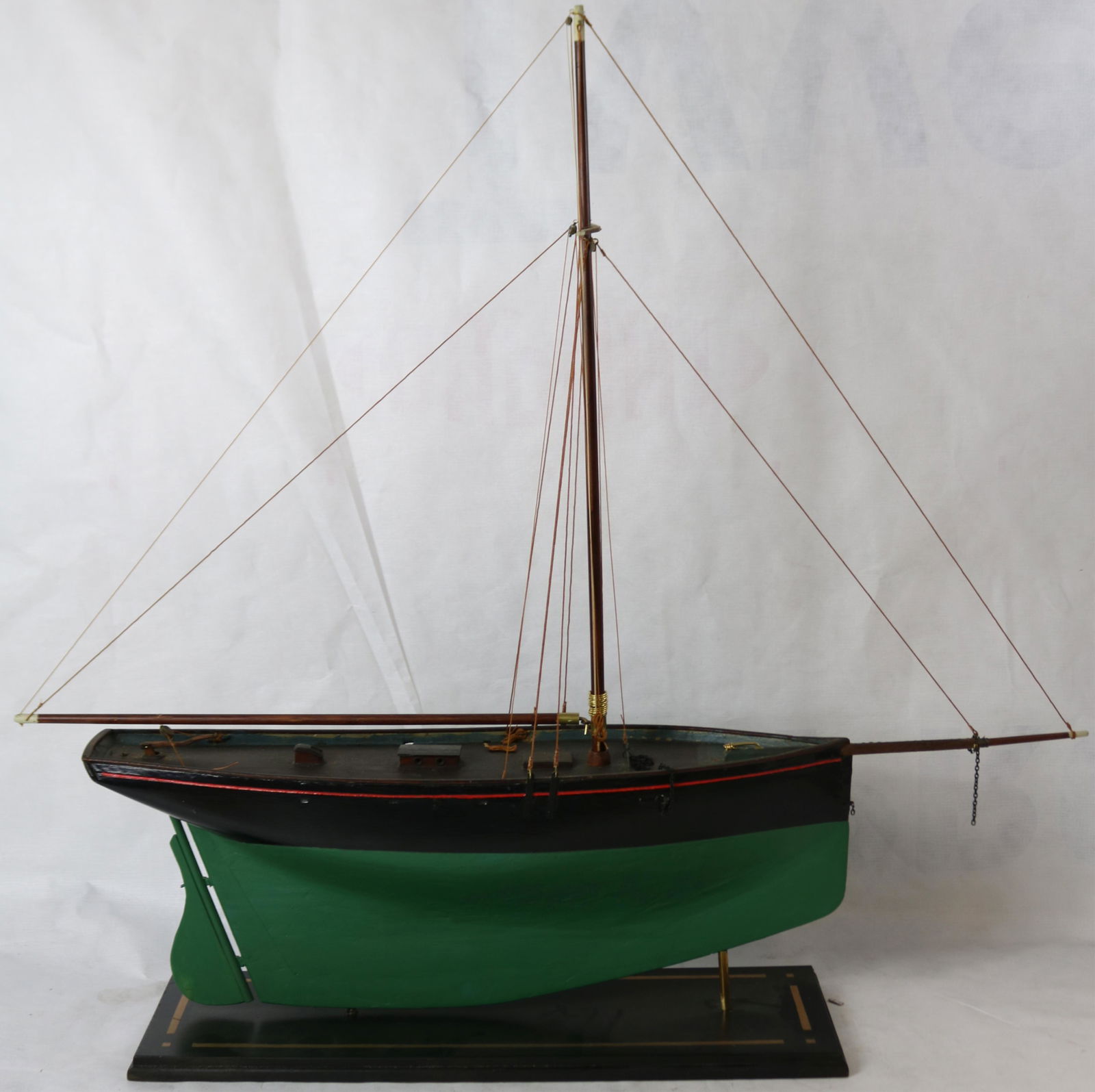 EARLY 20TH CENTURY WOODEN POND MODEL, HAS BEEN: REPAINTED AND RE-RIGGED. BRASS FITTINGS, NO SAILS. 33" HIGH WITH BASE, 5 3/4" WIDE, 33 1/2" LONG.