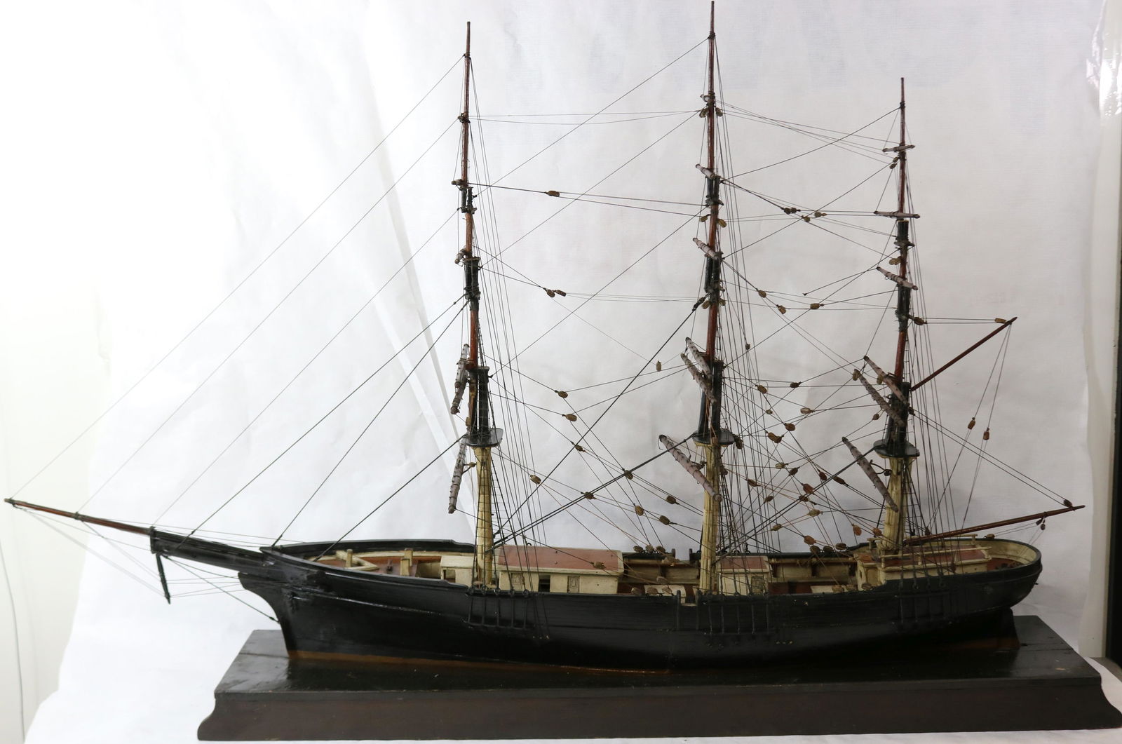 EARLY 20TH CENTURY WOODEN SHIP MODEL OF A: 3-MASTED SCHOONER, SAILS NOT PRESENT. HULL HAS BEEN REPAINTED. 31 1/2" HIGH WITH BASE, 48" LONG, 15" WIDE.