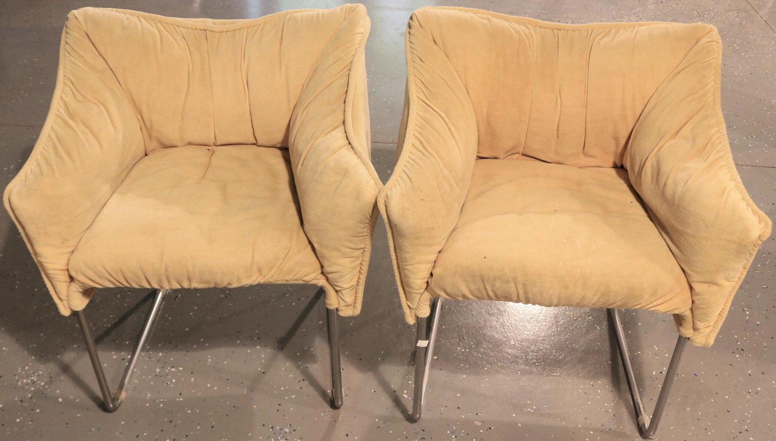 PAIR OF ELEGANT TAN VELVET AND CHROME HARVEY: PROBBER LOUNGE CHAIRS. IN GOOD ORIGINAL CONDITION, AGE APPROPRIATE. ONE CHAIR RETAINS THE ORIGINAL FACTORY LABEL. 30" HIGH, 26" WIDE, 22" DEEP. 19" SEAT HEIGHT.