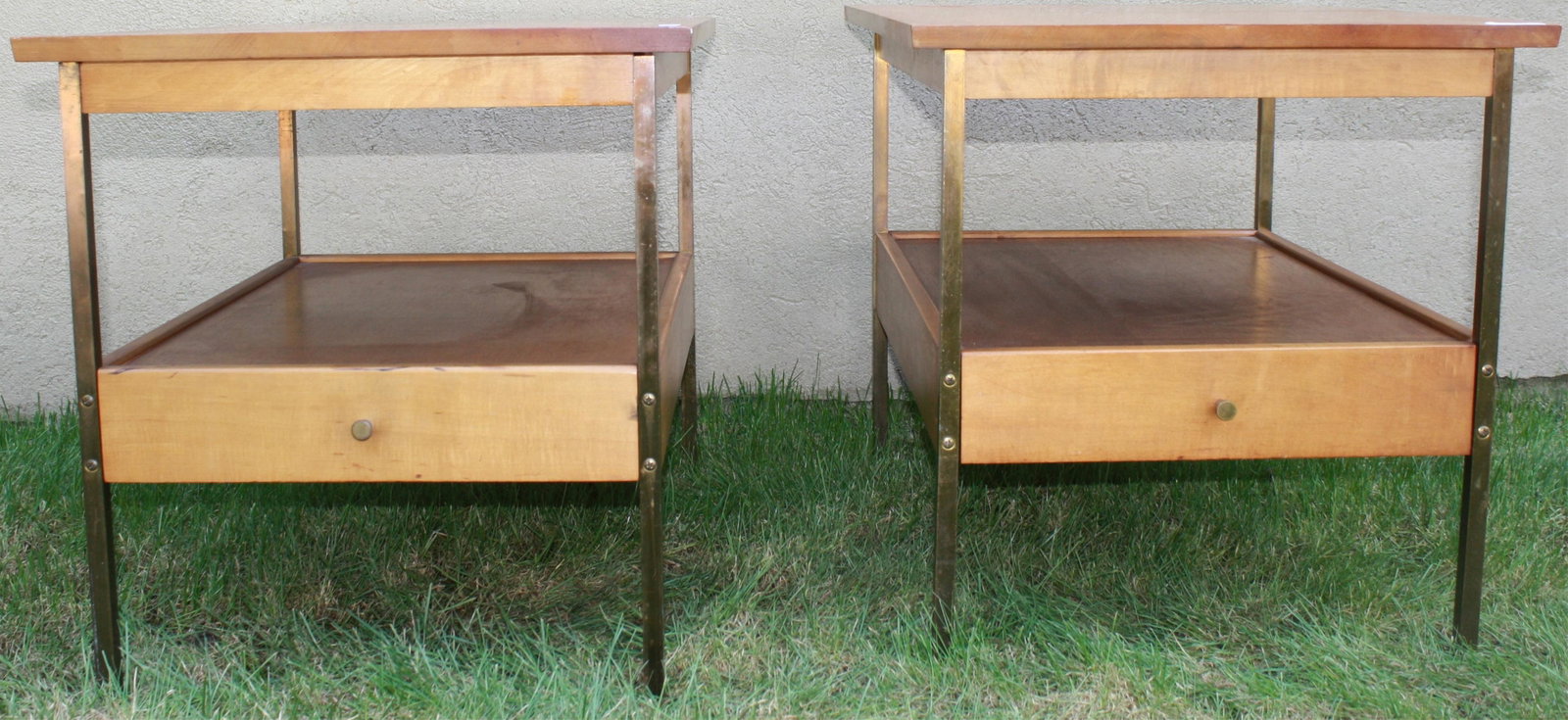 PAIR OF MID-CENTURY BRASS AND MAPLE END TABLES.: LOWER SHELF WITH DRAWER. POSSIBLY PAUL MCCOBB. 21" HIGH, 20" WIDE, 27 3/4" DEEP.