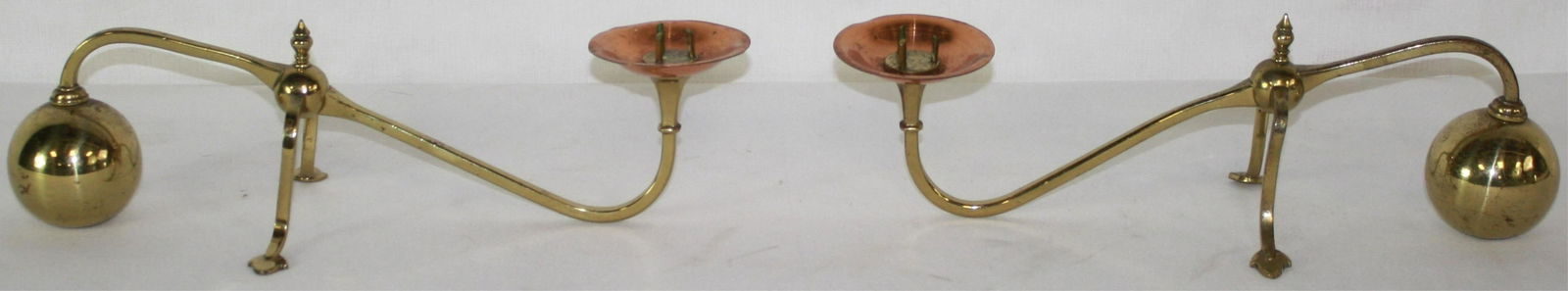 ATTRIB. WILLIAM ARTHUR SMITH BENSON (1854-1924,: BRITISH) ARTS AND CRAFTS CANDLESTICKS, CA. 1900. BRASS AND COPPER. SOME PITTING TO THE METAL, ONE BOBECHE SLIGHTLY DENTED. 4" HIGH, 14" LONG, 5 1/2" WIDE