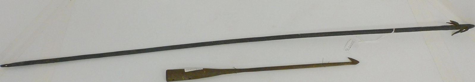 Two 19th century iron objects, to include: a: blackfish spear, 49" long, along with a swordfish spear, 19" long. Provenance: Originally owned by whaling Captain Philip H. Reed. Captain Reed commanded at least 8 whaling voyages out of New Bedford,