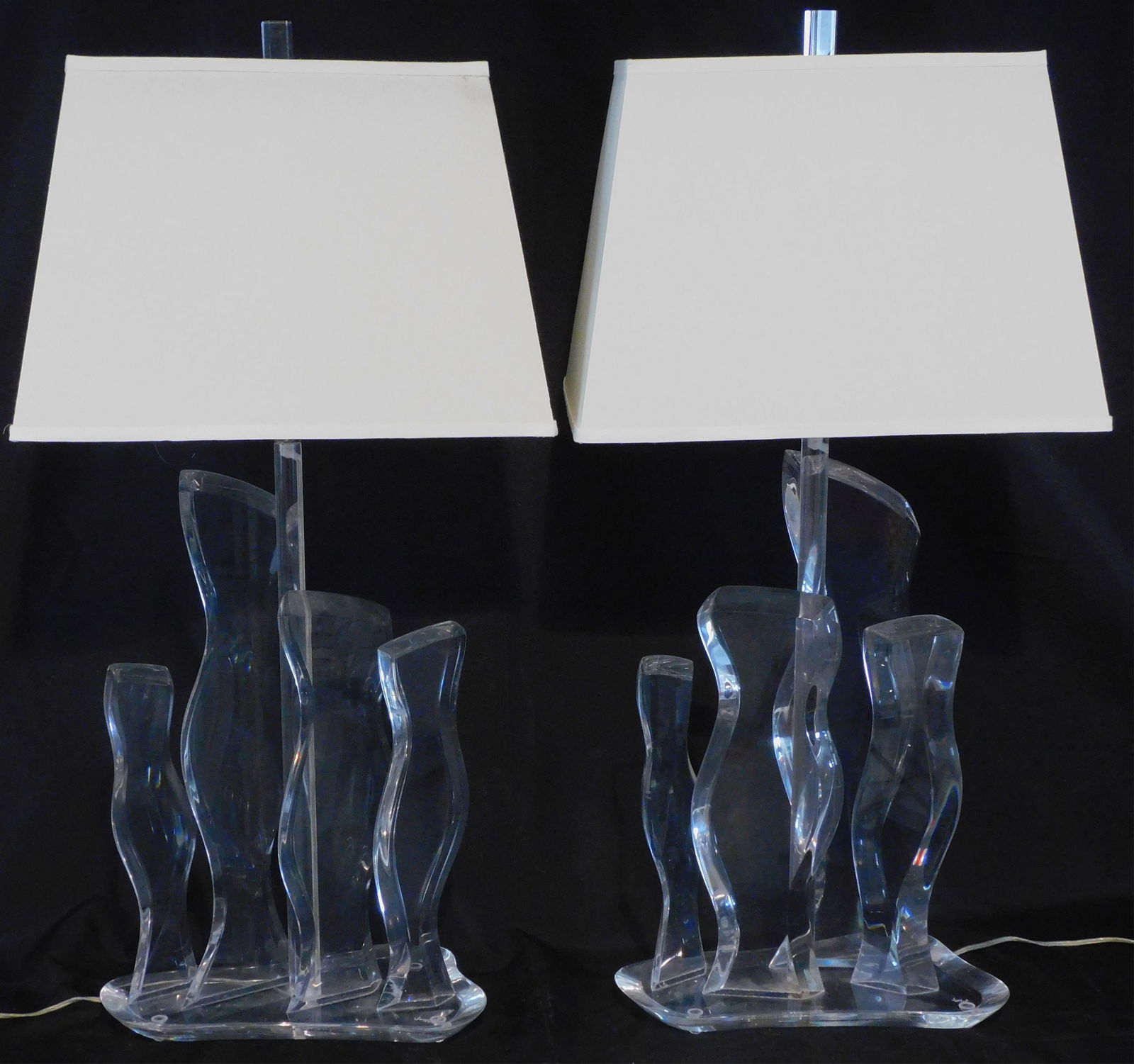 Hivo Van Teal, pair of mid century modern lucite: table lamps, signed on bases lower right. Wired for American use. 37" high, 14 1/2" wide, 8" deep. Height of lamp without shade is 25". Overall very good condition, minor surface abrasions and one sma