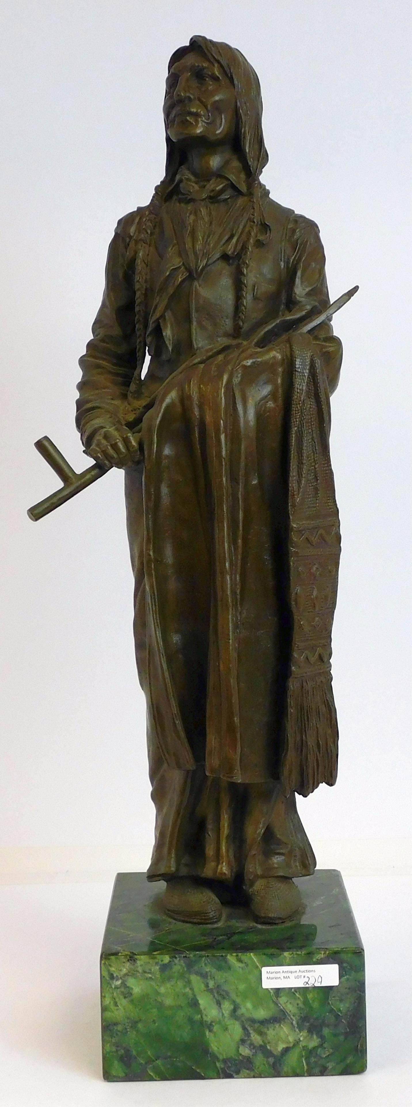After Carl Kauba (1865-1922) bronze sculpture: depicting Chief Wolfrobe on a green marble plinth. The figure is 21" tall, and with the base its 24 1/2". Base is 6" x 6". Signed century Kauba on the lower right side.