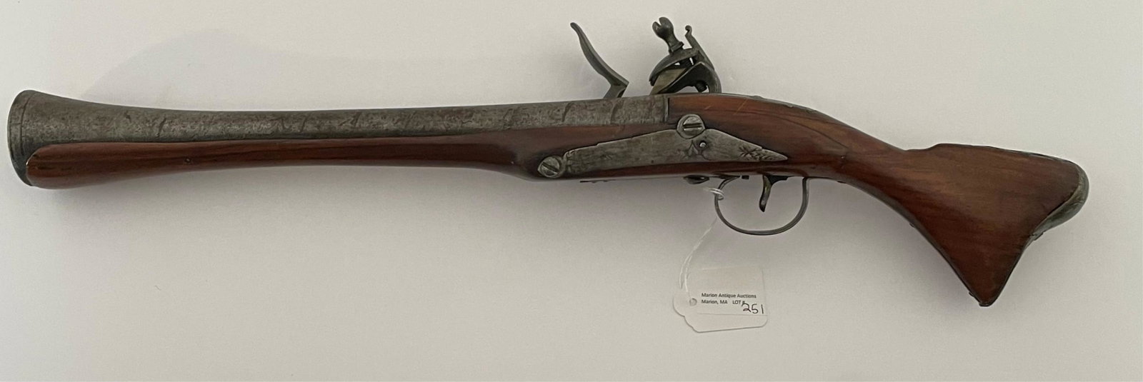 19th century Ottoman flintlock blunderbuss.: Firearm features a steel barrel and a walnut stock with engraved plates. Missing ramrod. 21" in length. Overall fair condition.