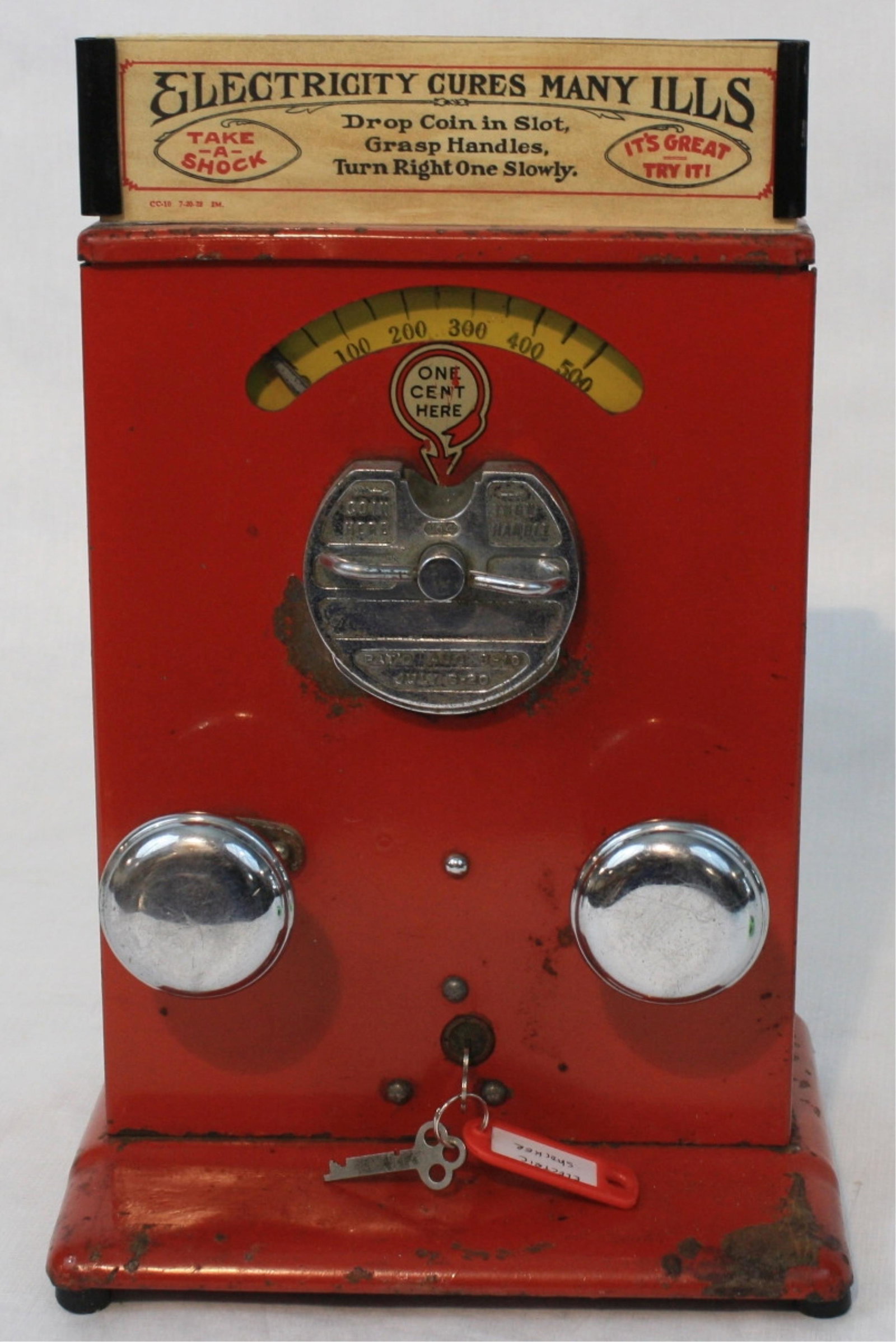Coin operated electric shock machine "Electricity: Cures Many Ills", early 20th century Battery operated, currently not working. No battery. You deposit one penny, put your hands on the knobs. It will then deliver the shock. You are able to increase t