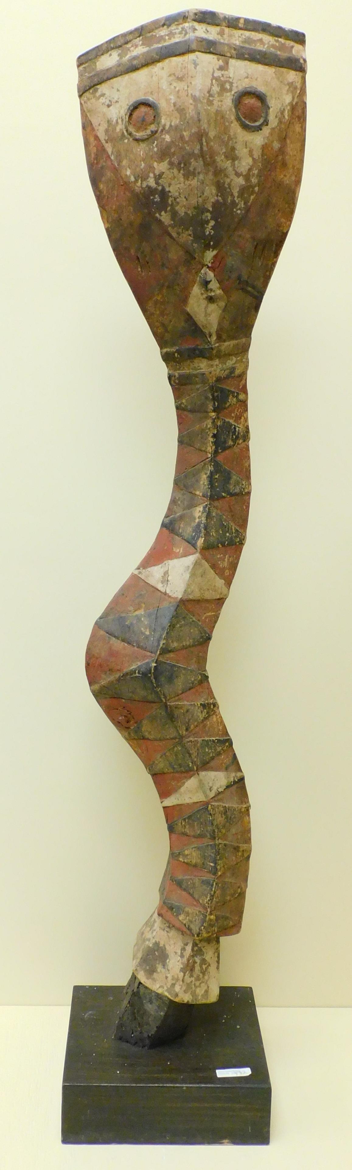 Early 20th century African polychrome painted snake: carving. On a wood base. Overall 51 1/2" high, carving is 48" high. Approx. 10" wide.