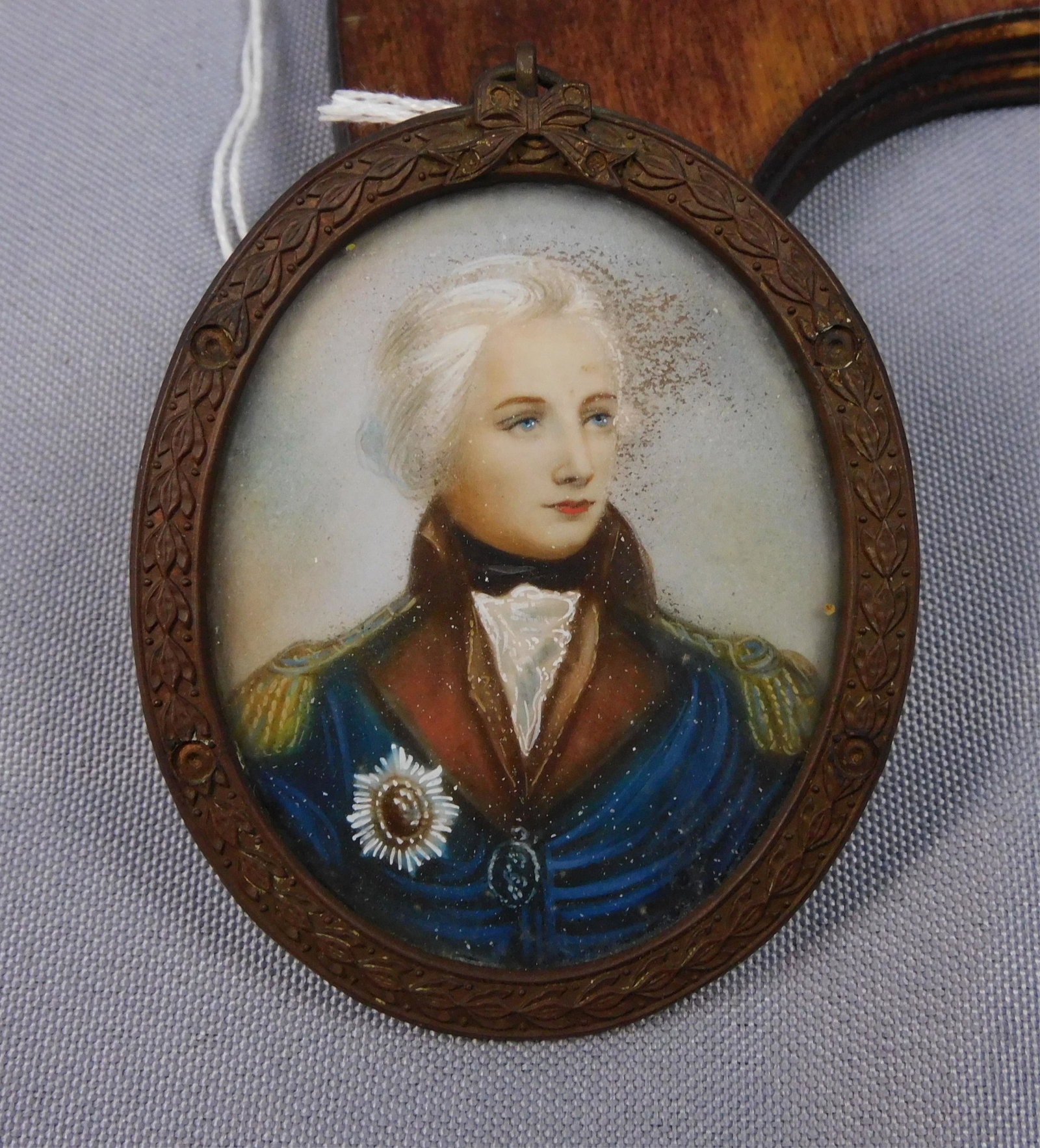 Miniature painting on ivory, early 19th c.,: depicting a young British naval officer, possibly related to the Victory. 3" x 2", period embossed brass frame. Provenance: Webb estate.
