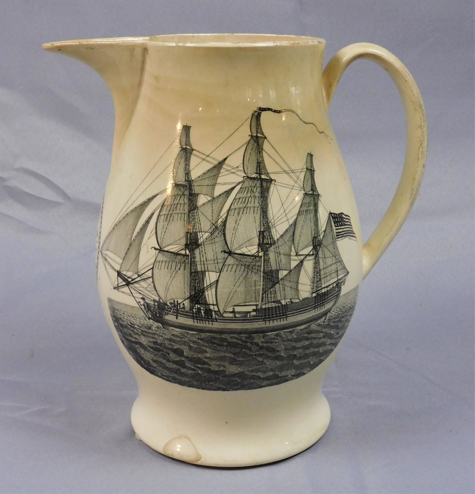 Liverpool jug, Washington in Glory, early 19th c.: Depicts a memoriam for Washington titled America in Tears. A motto under spout which reads A Man without example, a Patriot without reproach. Three-masted ship on the other side flying the American fl