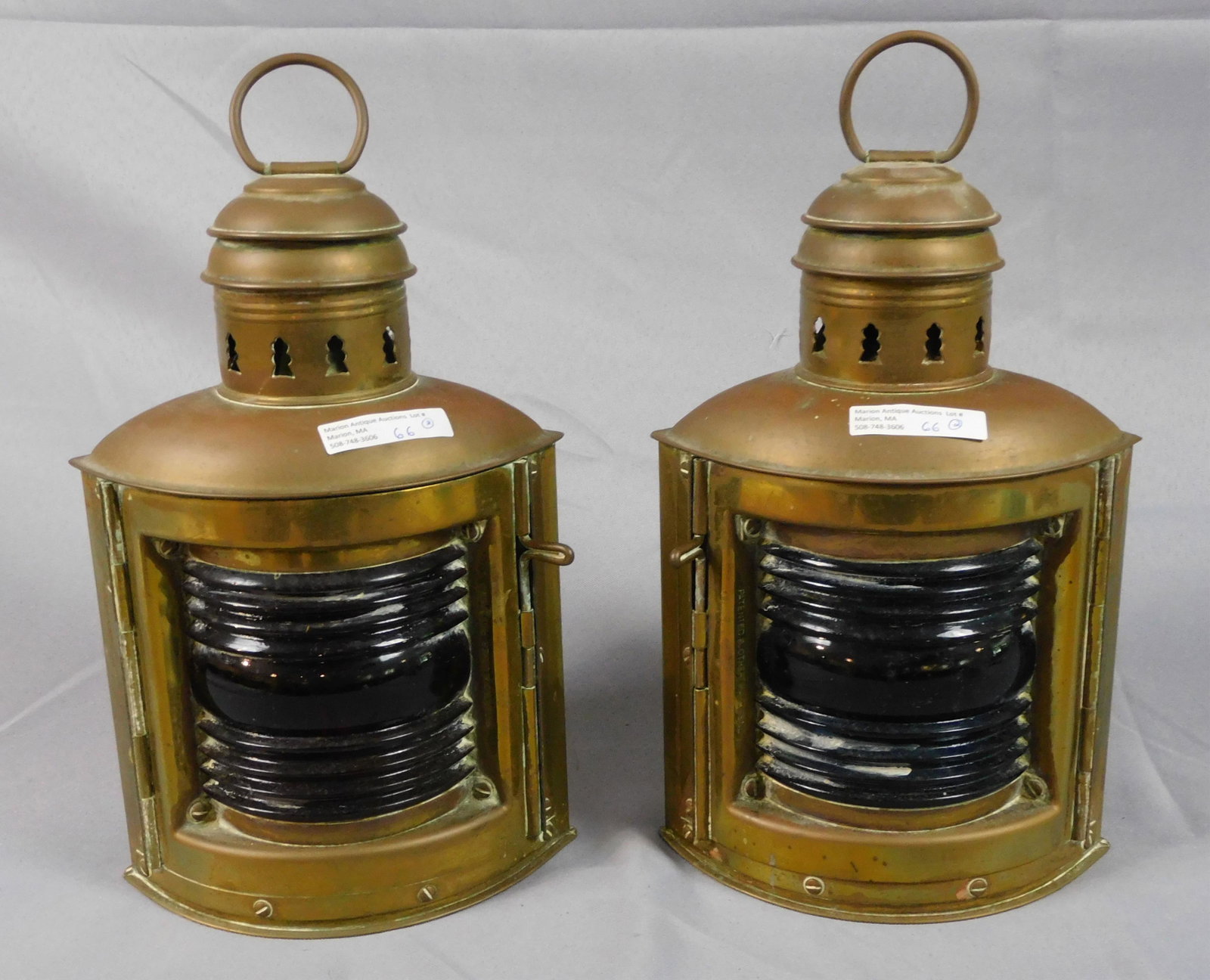 (2) signed Perko brass nautical port and: starboard lanterns, late 19th c. 12 1/2" high, approximately 8" wide. Good, original condition. Both have burners. Provenance: Webb estate.
