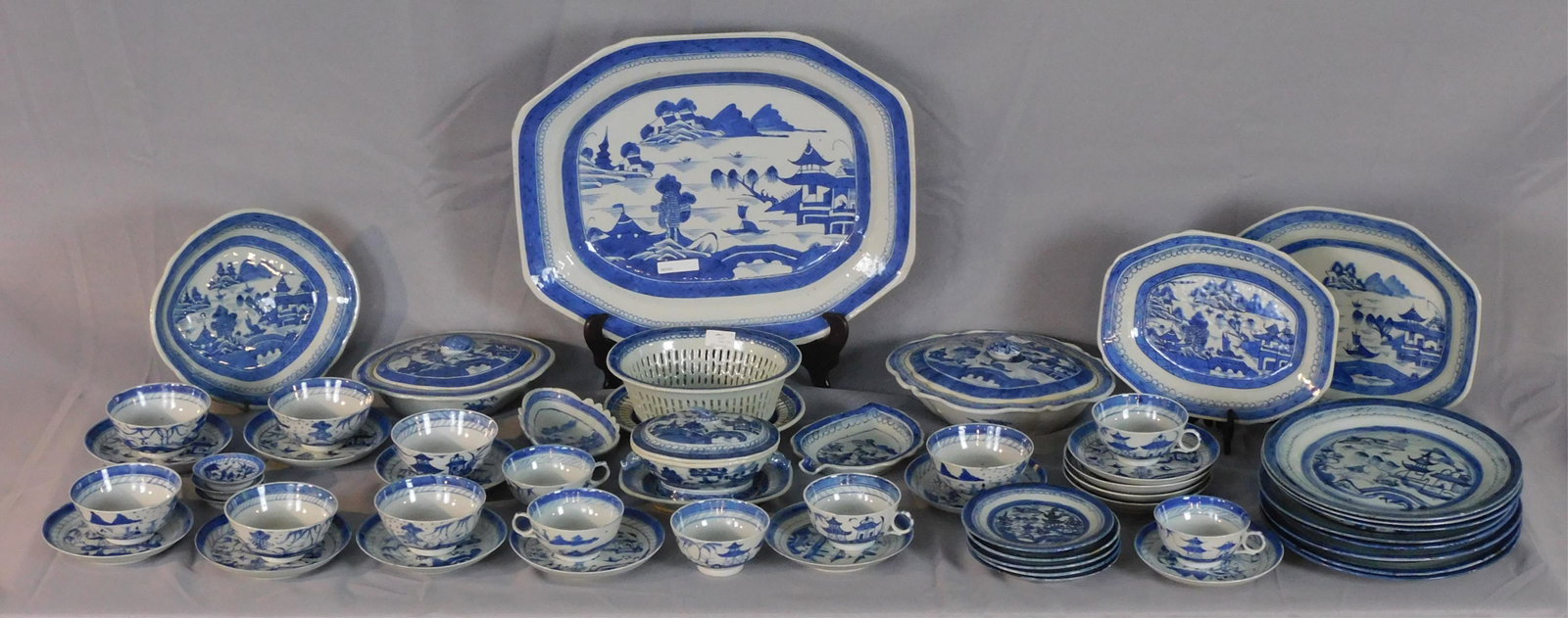 55-piece Canton lot, primarily 19th c, with some: 20th c. Chinese porcelain. To include: 8 dinner plates (10" diameter), 5 bread plates (6" diameter), platter (7 3/4" x 10"), platter (9" x 11 3/4"), leaf shaped dish (5 1/4" x 6 3/4"), large platter (