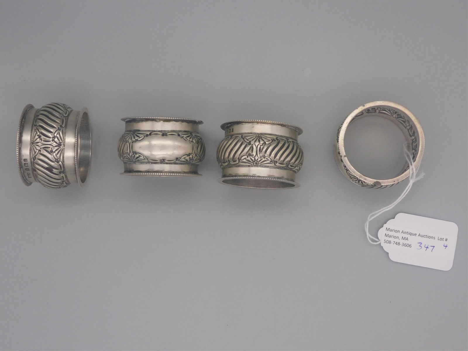 (4) English sterling silver napkin rings, ca.: 1900. Birmingham. Ribbed central border. 3.5 ozt total.