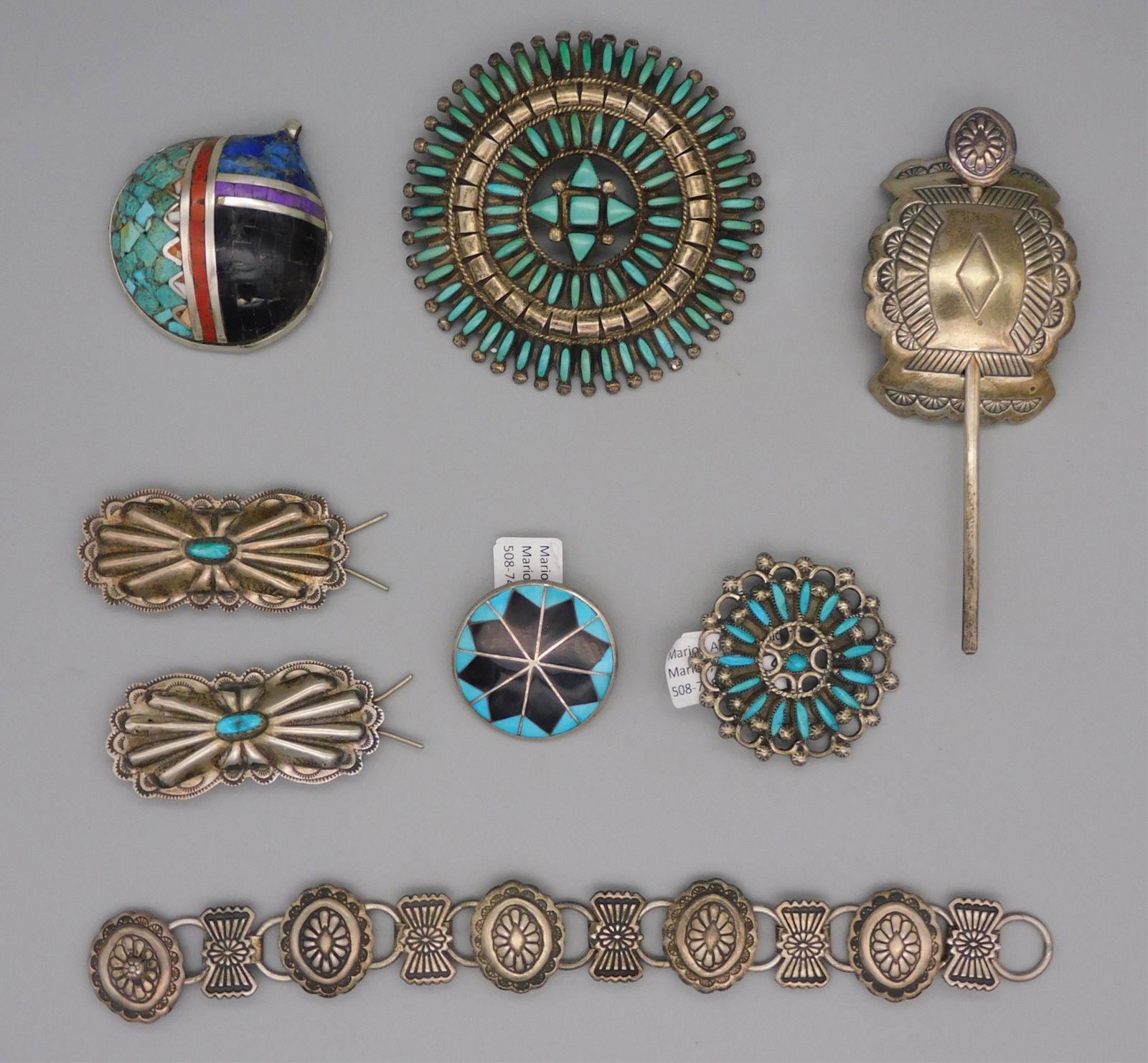 (8) Native American Silver Jewelry. 20th century.: American Southwest. Vintage pawn silver, to include 3 silver pins with turquoise inlay one marked BE. A sterling and turquoise chip inlay shell pendant. 3 silver hair clips. Unmarked silver bracelet 7
