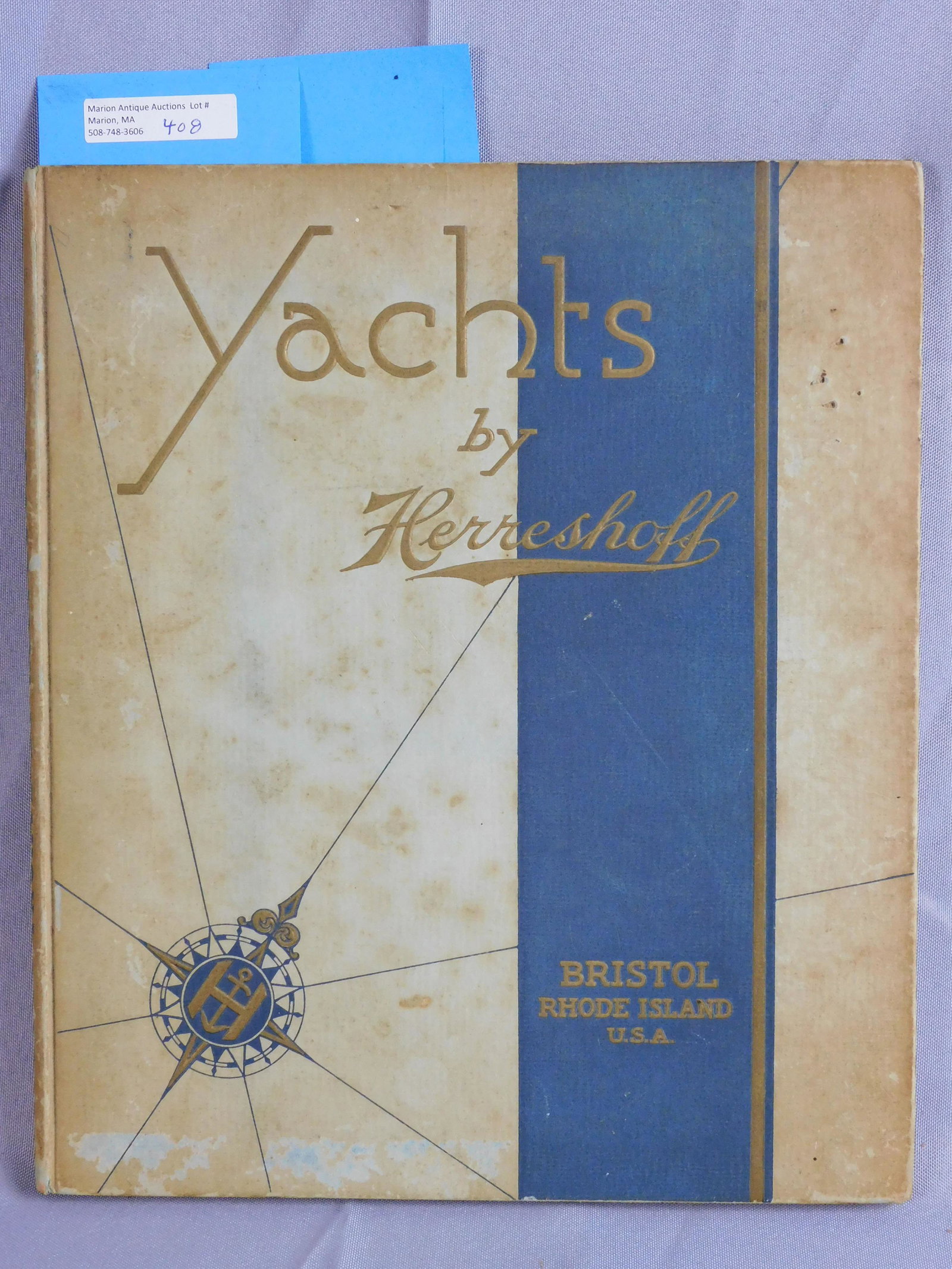 "Yachts by Herreschoff", hardcover book, early: 20th c. 12" x 10". Limited edition number #657, presented to Paul Burdett. 53 pages with colored and black and white illustrations. Also rig and sail plans. Boards show scuffing and discoloration, som