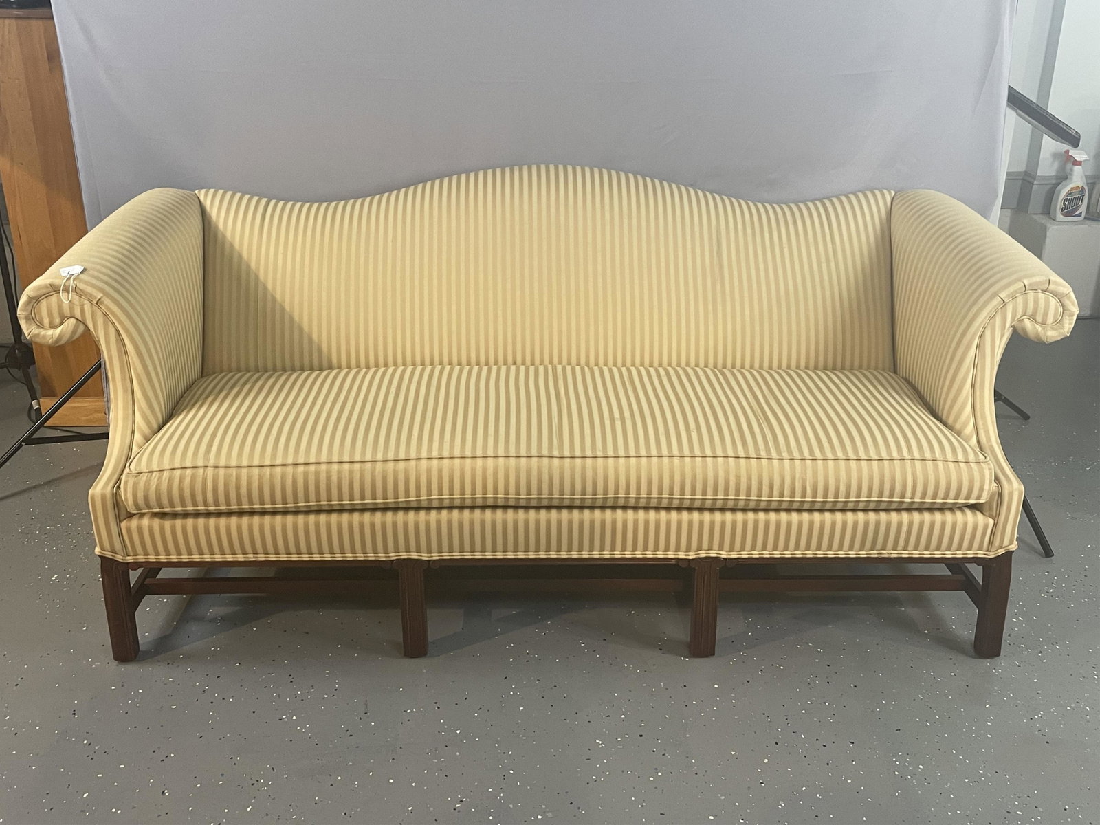 Modern high quality Chippendale style upholstered: sofa. Camelback, straight reeded legs. 33" high, 91" long, 36" deep, 20" seat depth. Upholstery is in very good condition.